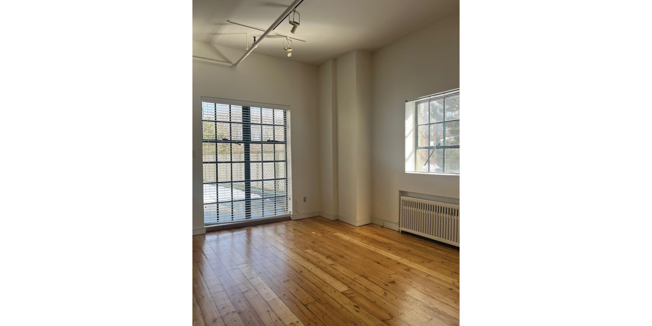 225 Macpherson Avenue includes a sunlit office with large windows and hardwood floors.