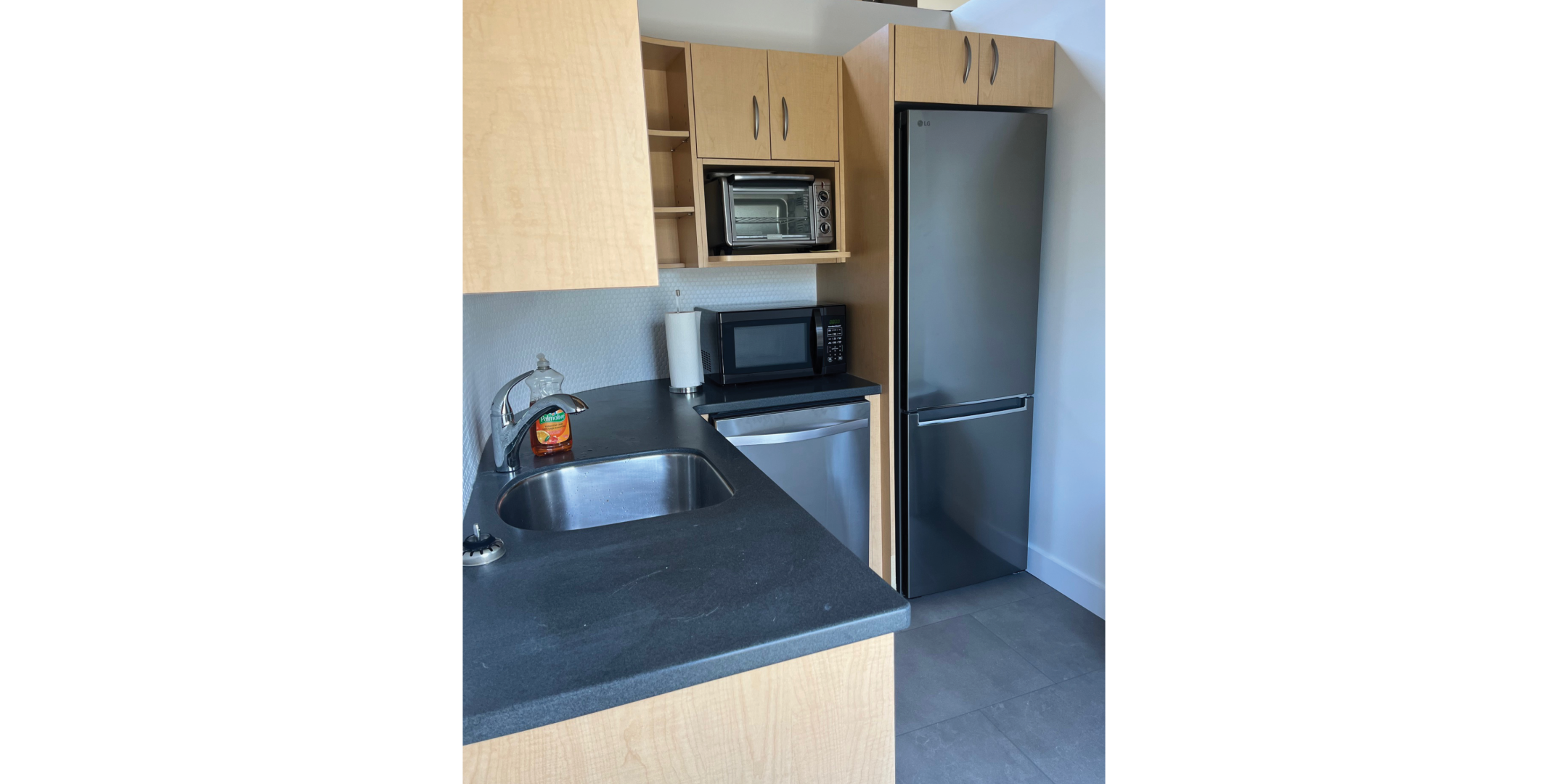225 Macpherson Avenue features a modern kitchenette with sink and appliances.