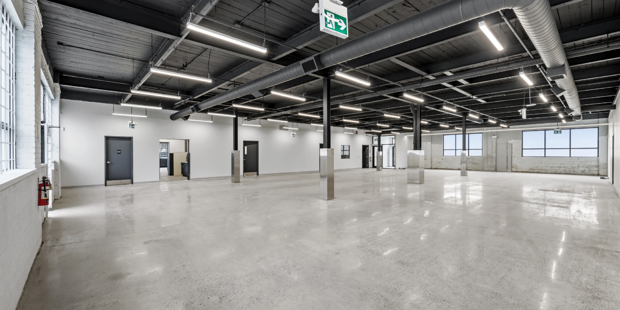 30 Bermondsey Road bright empty room with exposed ceilings and concrete floors