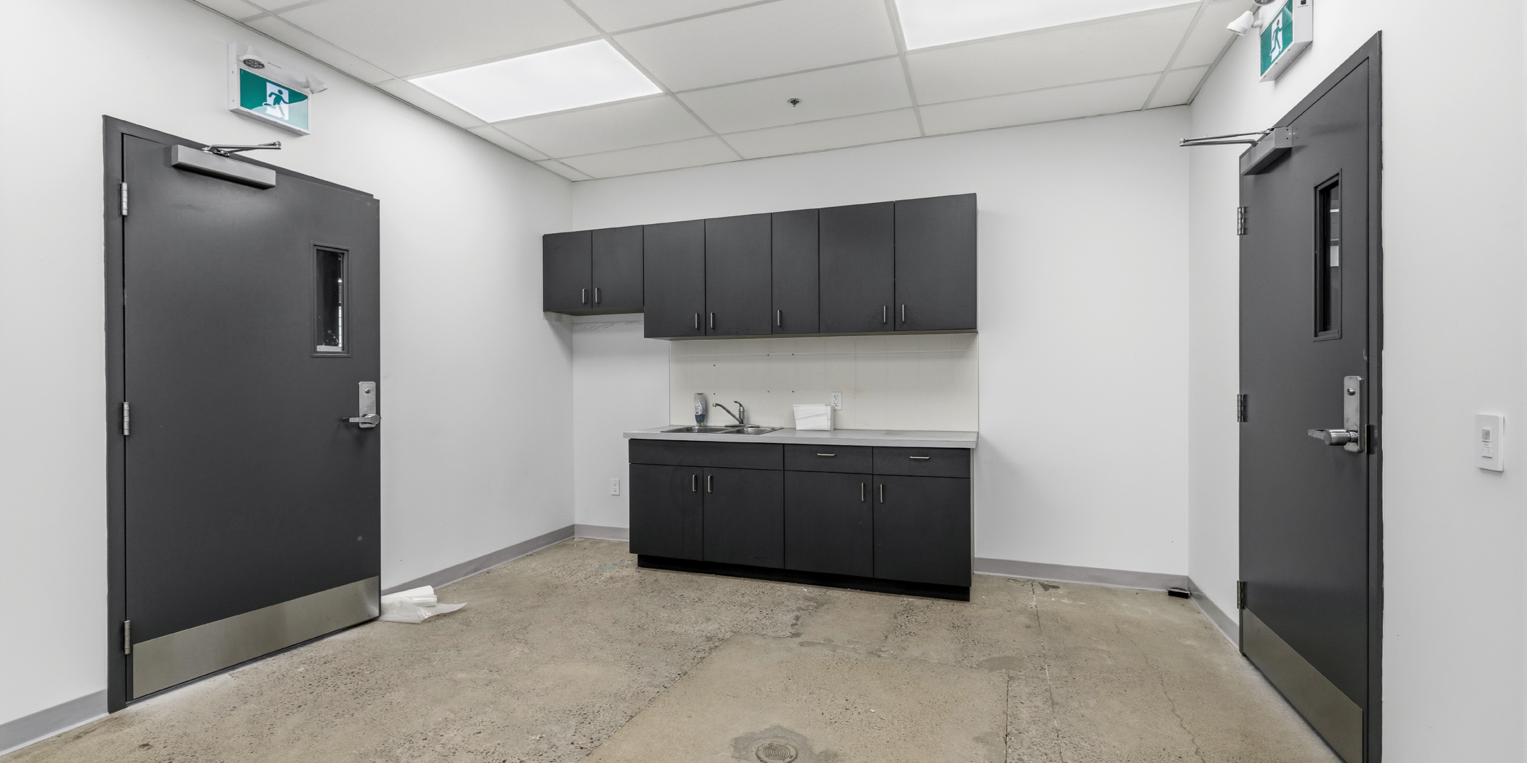 30 Bermondsey Road room with cabinetry and sink