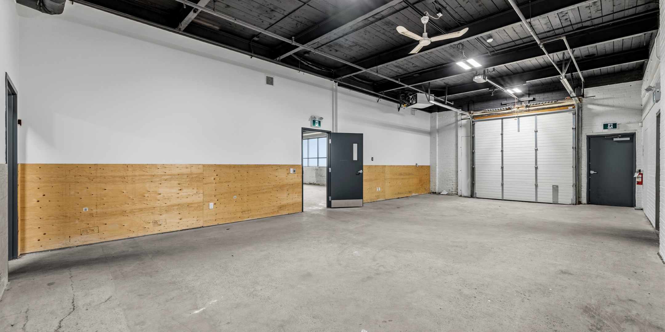 30 Bermondsey Road empty room with a dock door and exposed ceilings