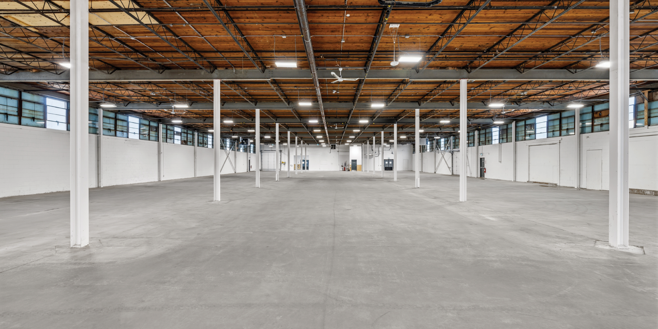 30 Bermondsey Road  wide, open industrial space with high ceilings, white columns, and a concrete floor