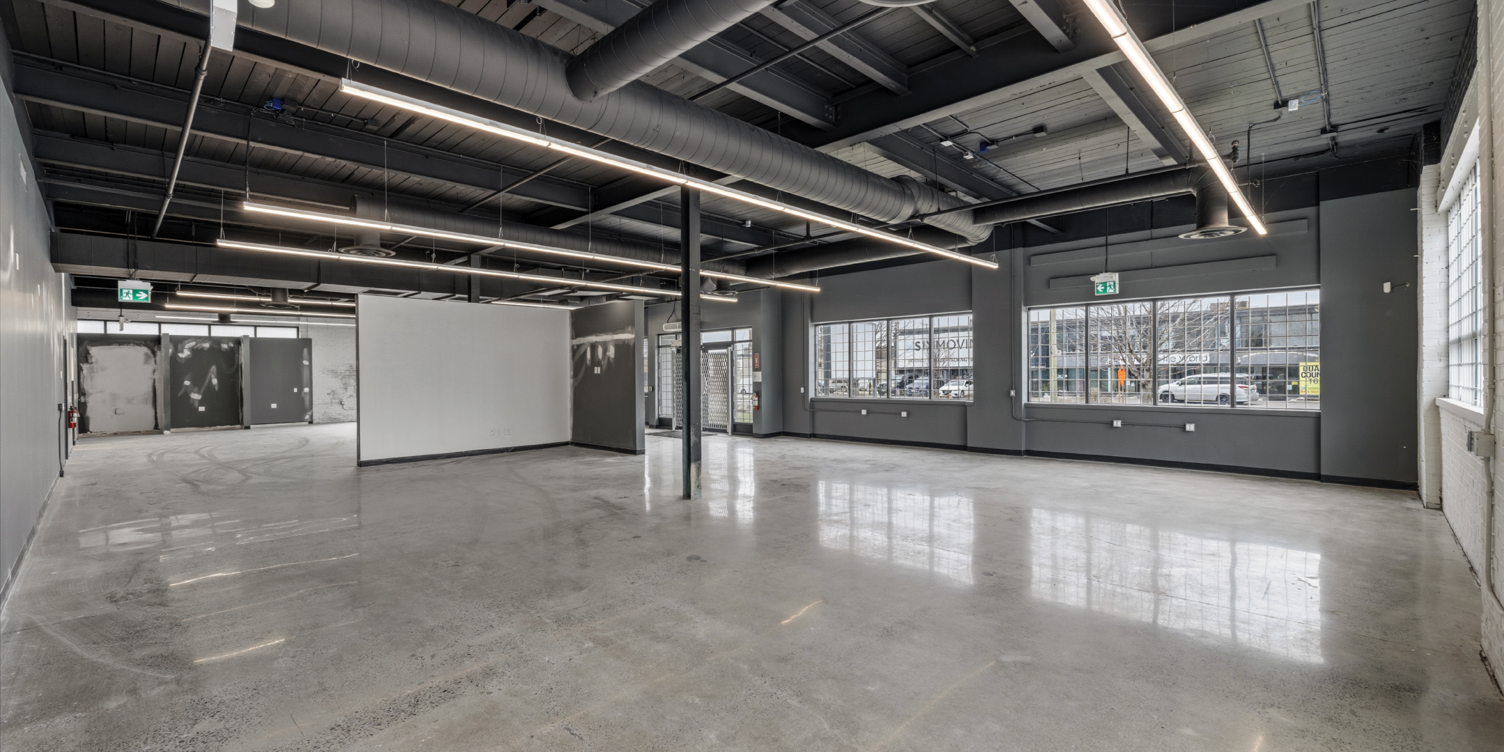 30 Bermondsey Road showroom with exposed industrial ceilings and concrete floor