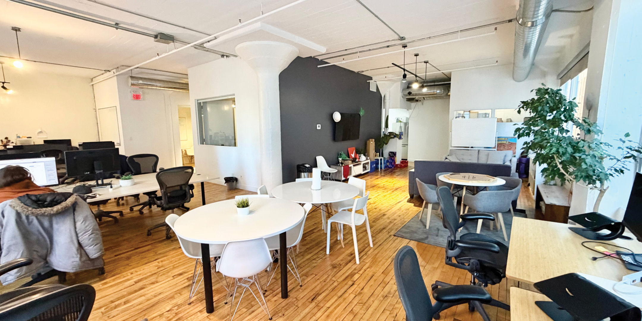 317 Adelaide Street W open office with tables and lounge space