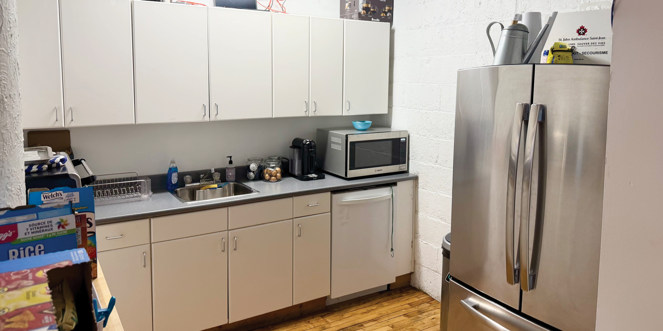 317 Adelaide Street W office kitchenette with fridge and cabinets