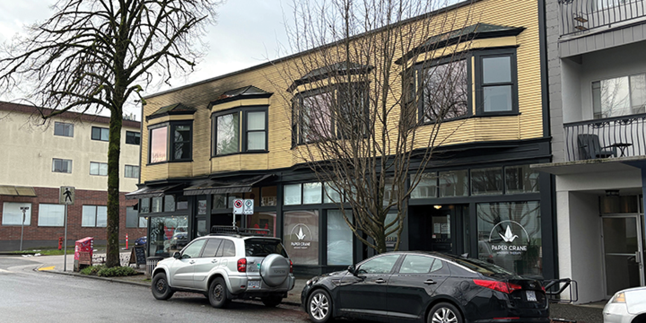 3589-3599 Commercial Street building exterior showing main entrance, main intersection, and street parking