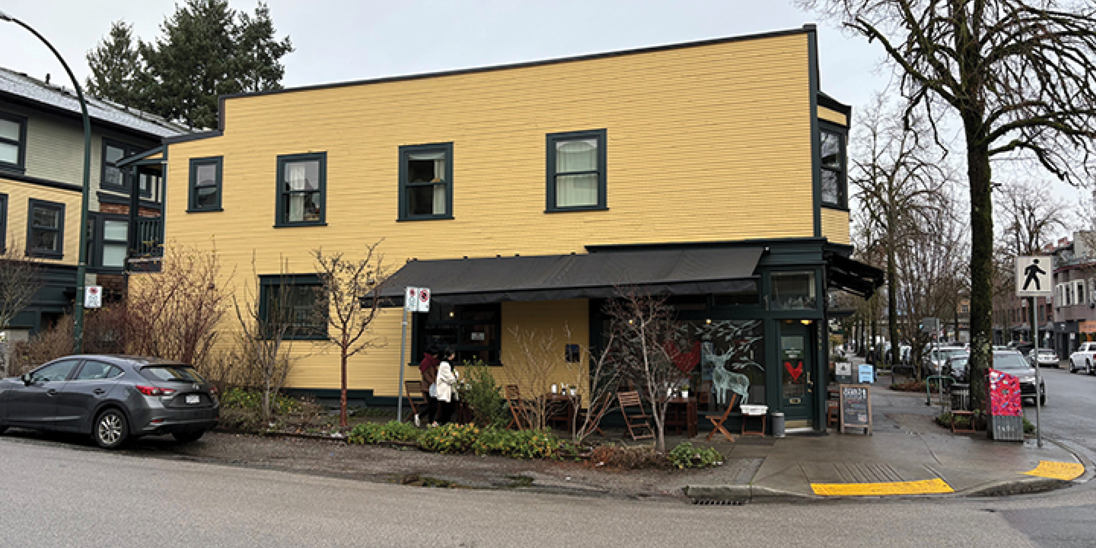 3589-3599 Commercial Street building exterior showing side and main intersection