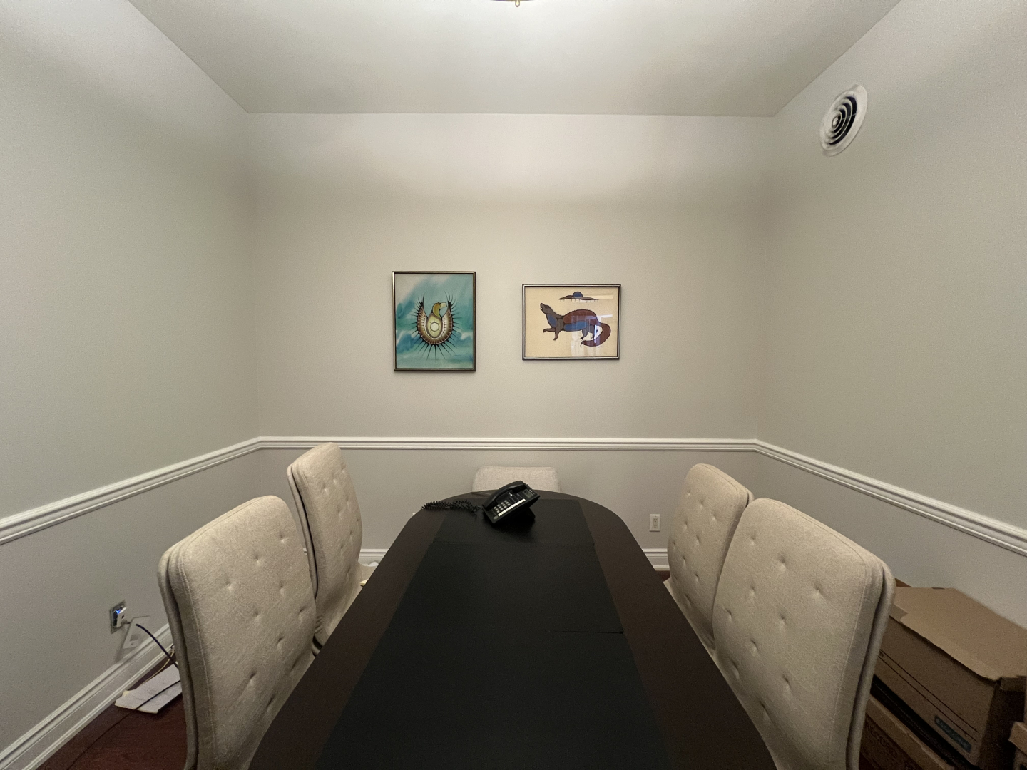 372 Bay Street boardroom with two paintings overlooking the conference table