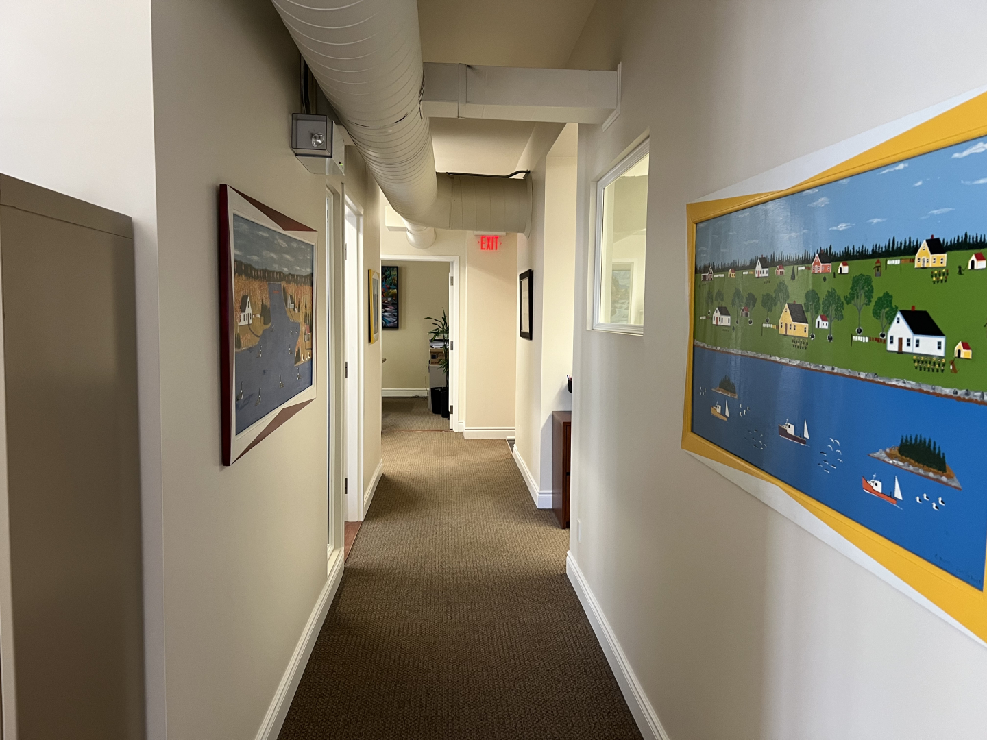 372 Bay Street office corridor with several paintings on the wall