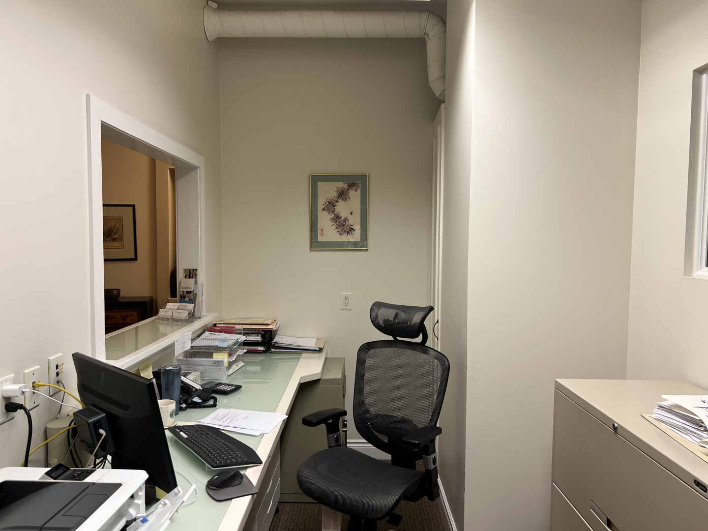 372 Bay Street small office with a desk and chair on the left side