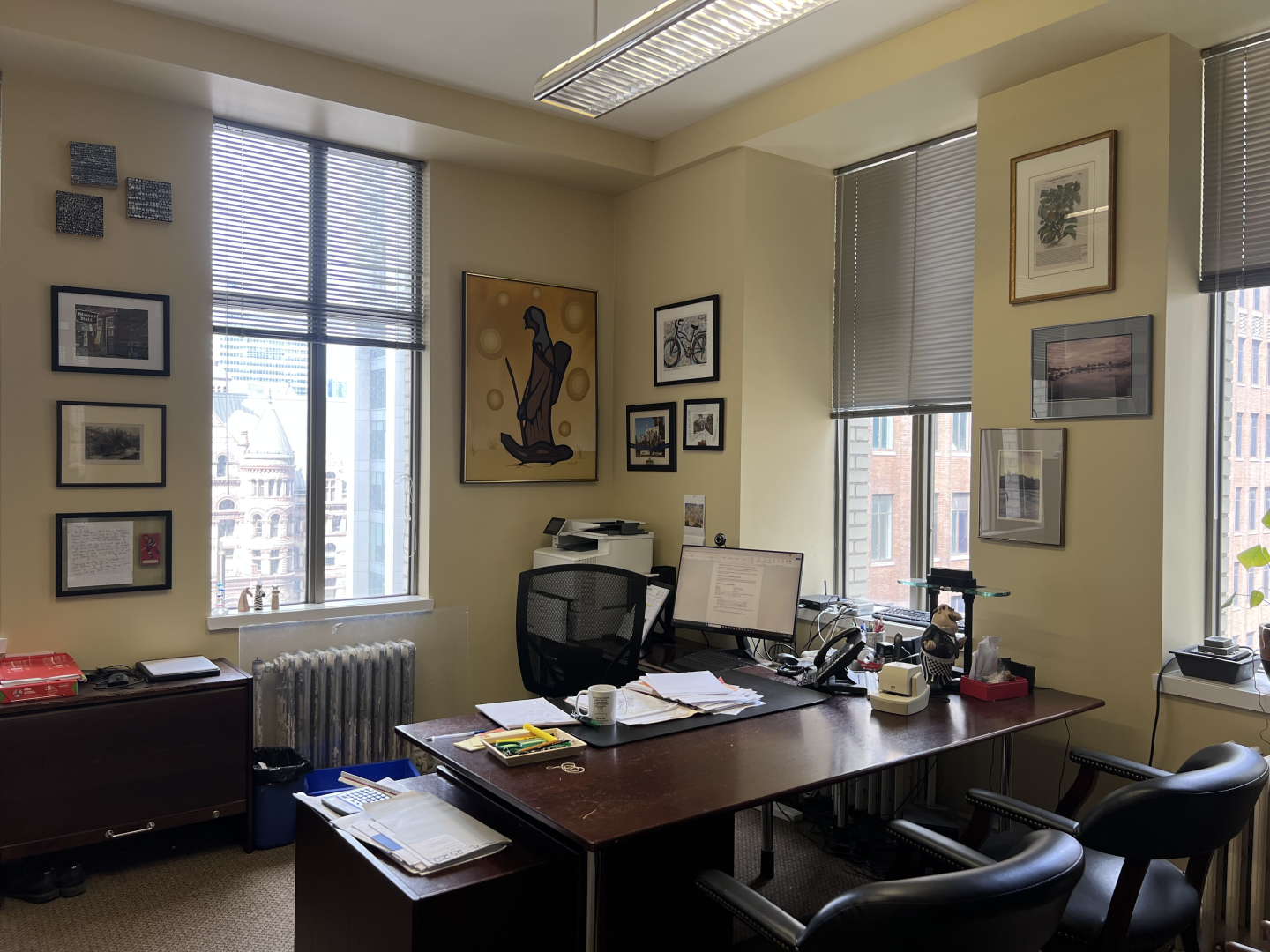 372 Bay Street small office with several big windows overlooking a desk and chairs