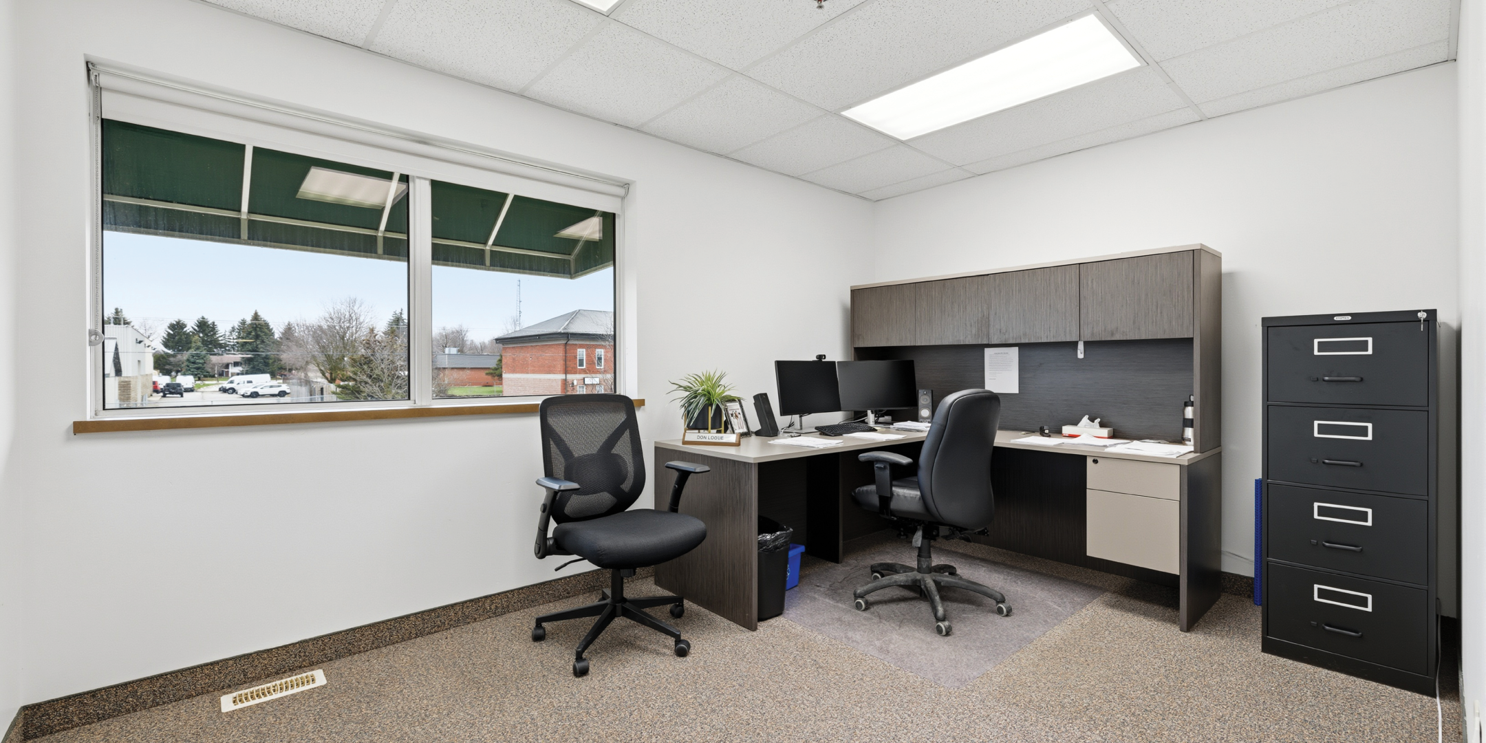 Private office with desk and filing cabinet
