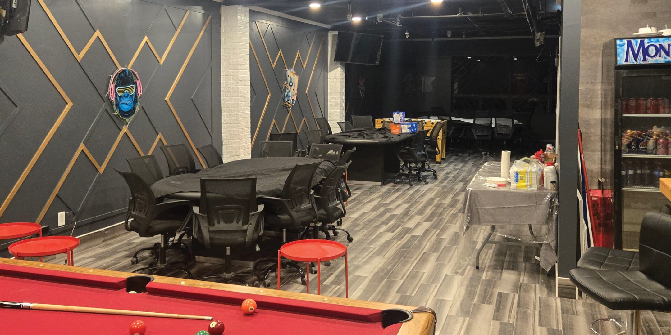 750 Oakdale Road interior with pool table, tables, chairs, and fridge