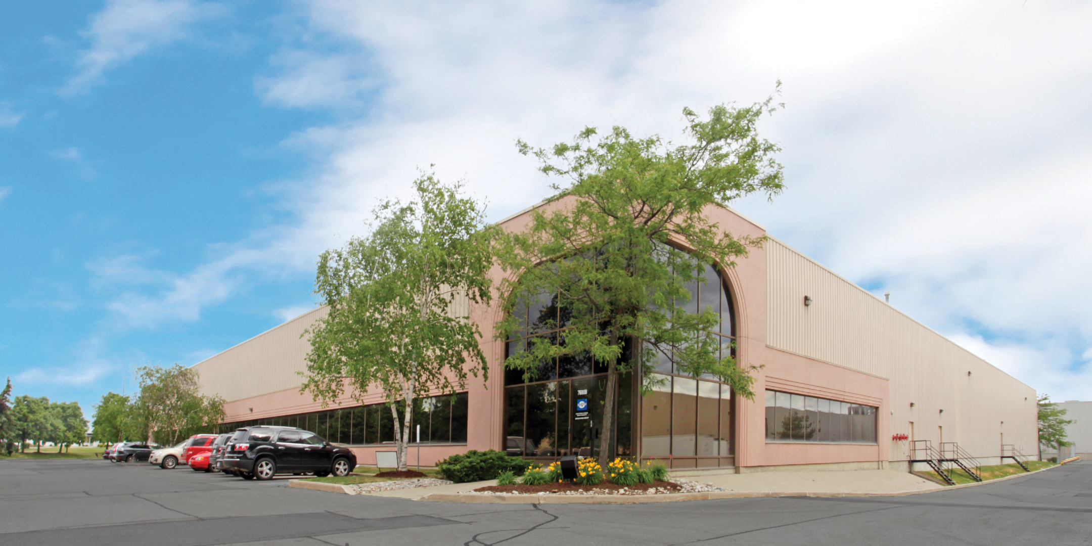 7680 Tranmere Drive front exterior showing the driveway and building number