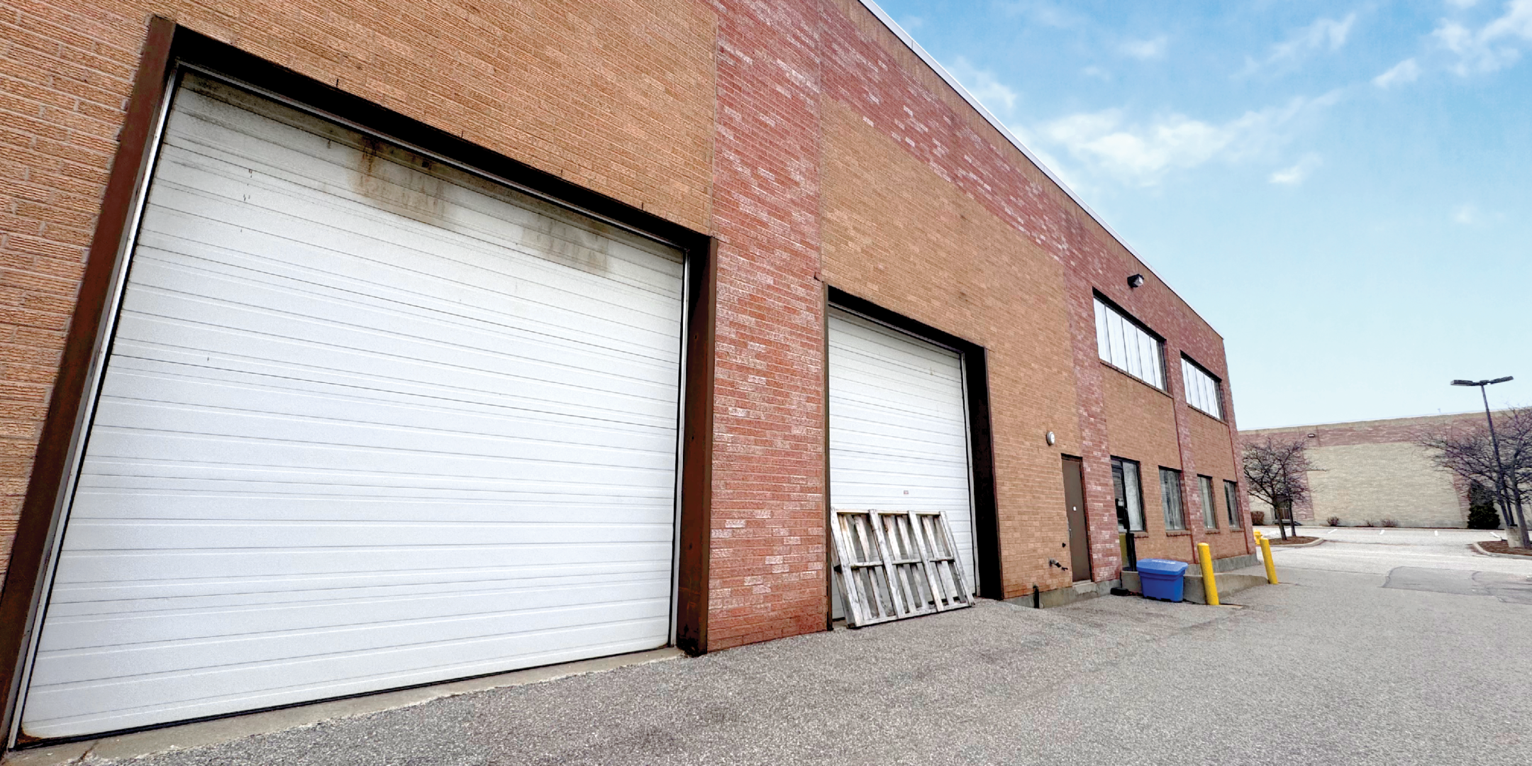 8811 Keele Street exterior with two drive in doors and driveway
