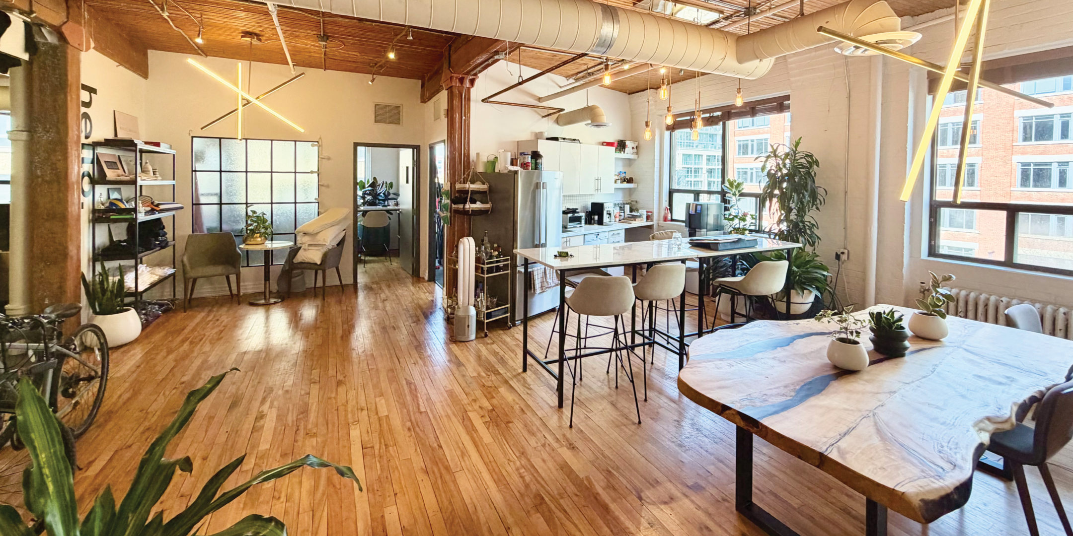 116 Spadina Ave open office with kitchen island and seating area