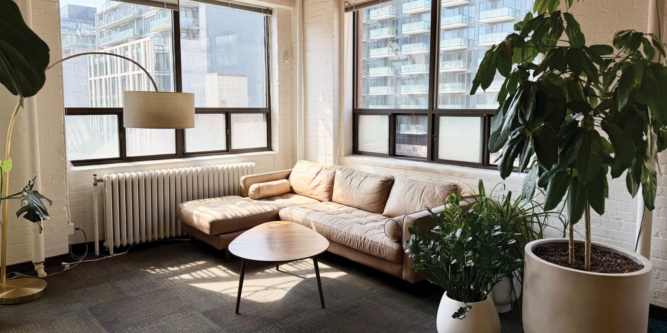 116 Spadina Ave lounge area with sofa and natural light