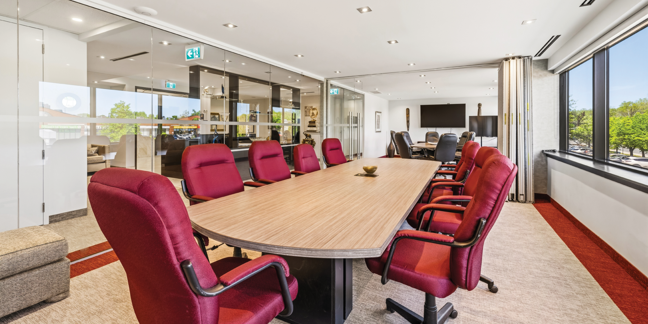 1270 Central Parkway W conference room with red chairs and large meeting table