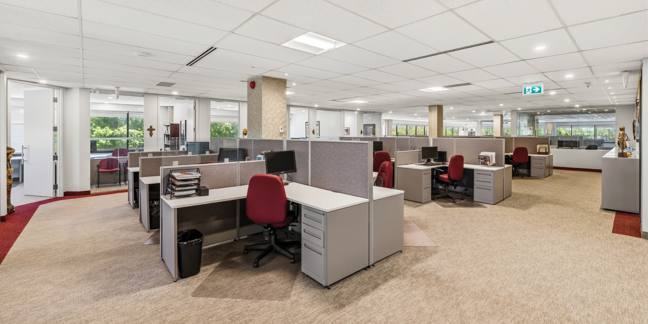 1270 Central Parkway W modern cubicle workspace with red office chairs