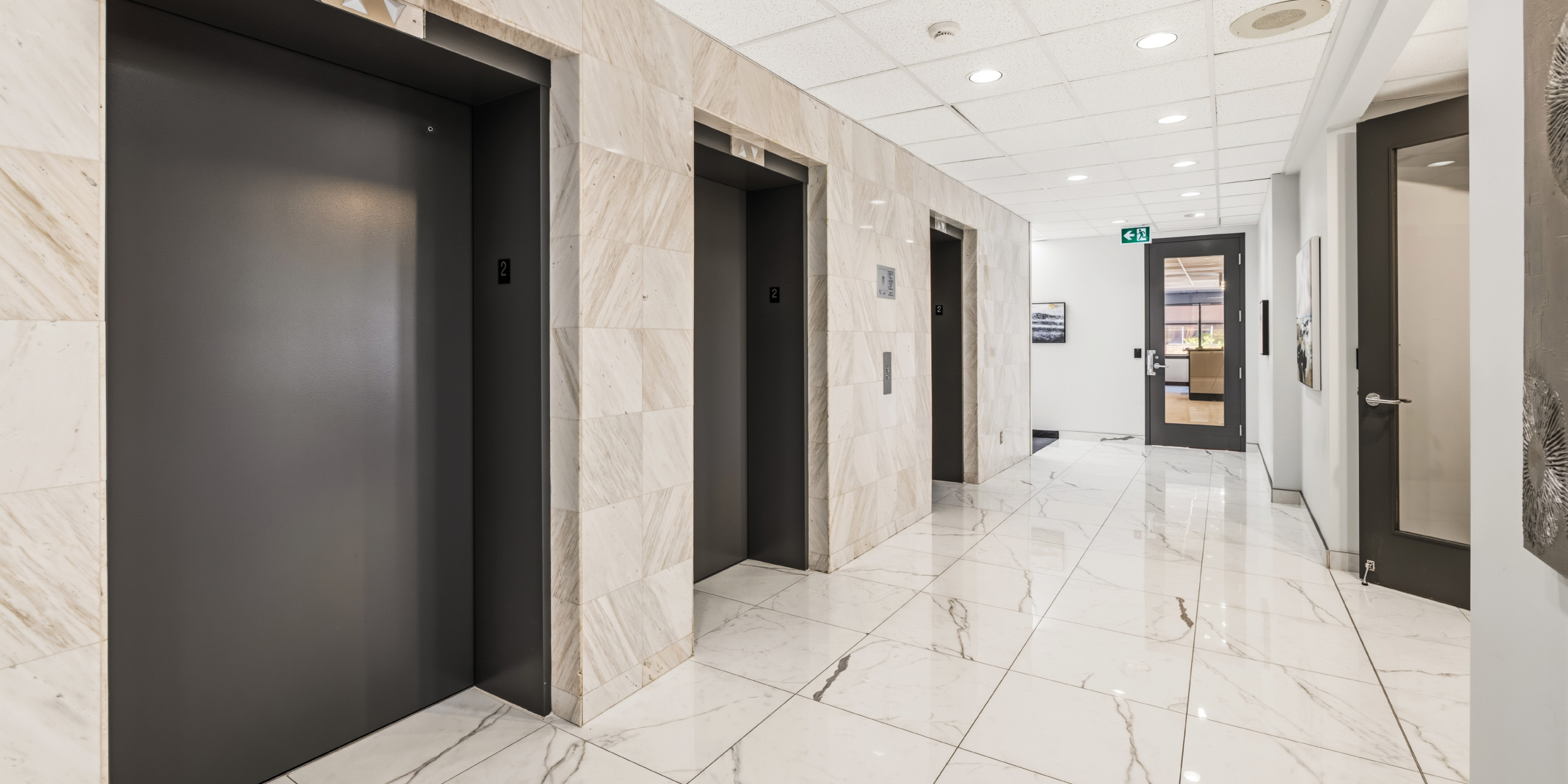 1270 Central Parkway W elevator lobby with marble flooring and modern finishes