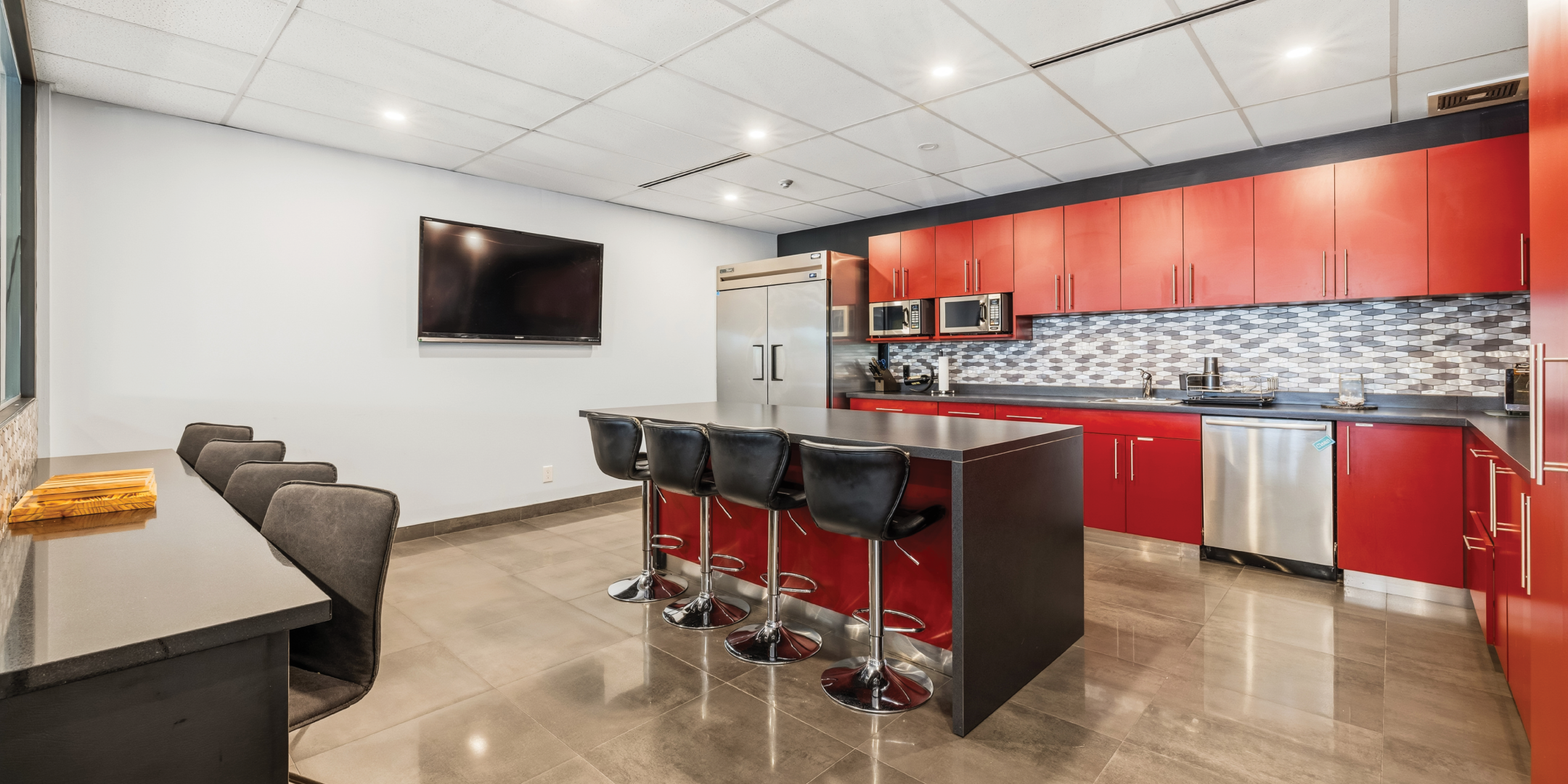 1270 Central Parkway W modern kitchen with red cabinets and island seating