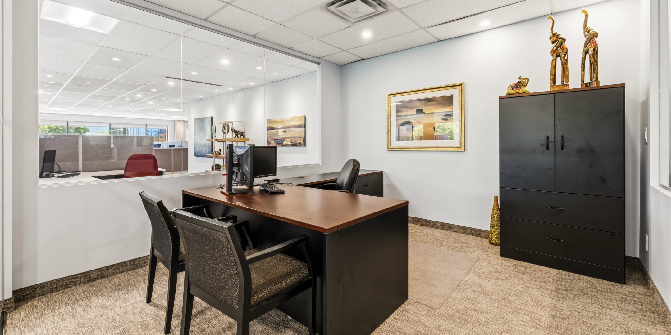1270 Central Parkway W private office with desk and guest seating
