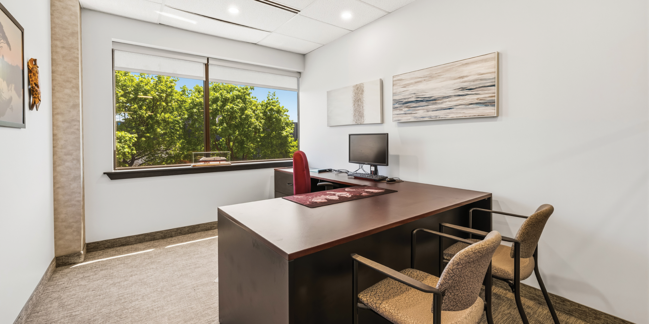 1270 Central Parkway W private office with large window and guest seating