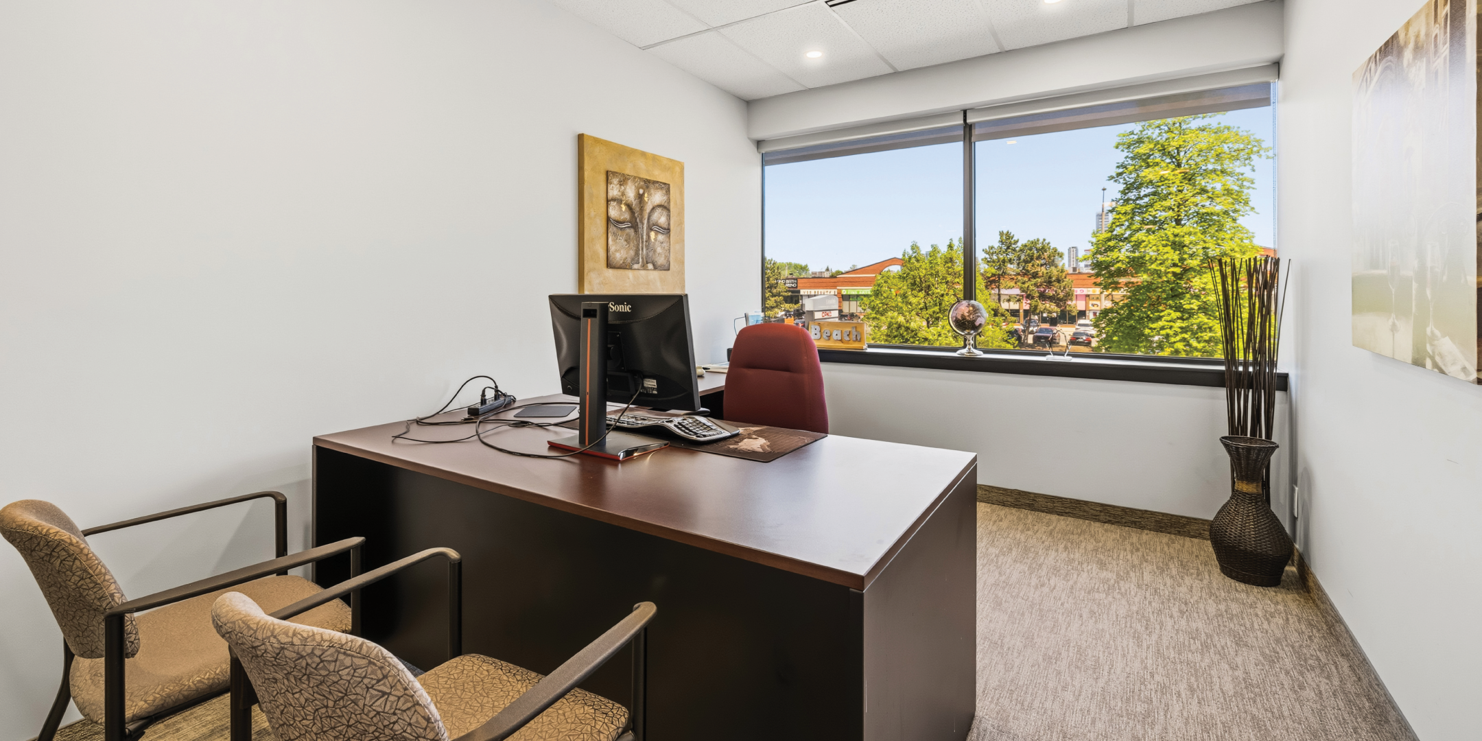 1270 Central Parkway W executive office with large windows and desk