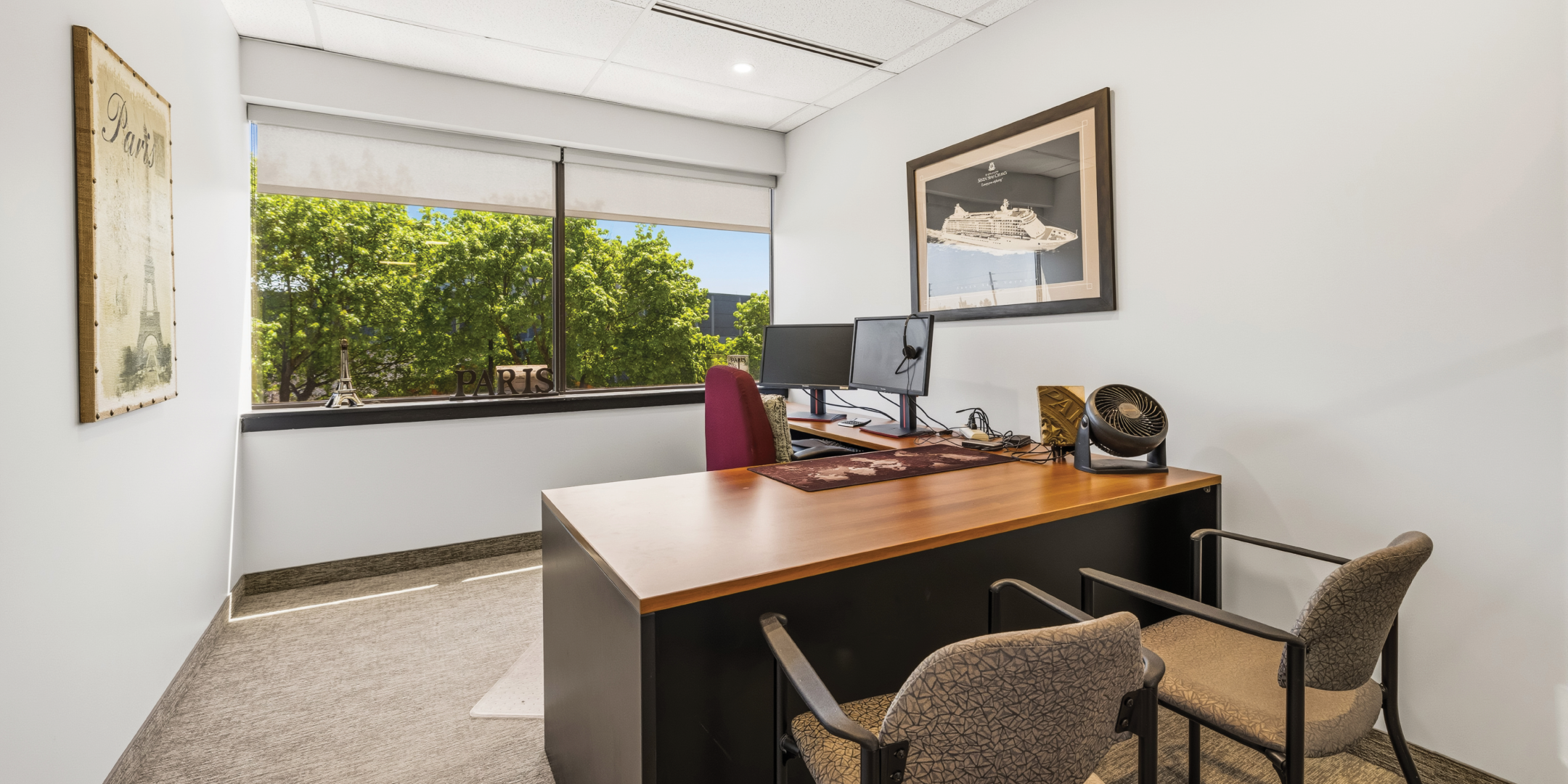 1270 Central Parkway W private office with dual monitors and natural light