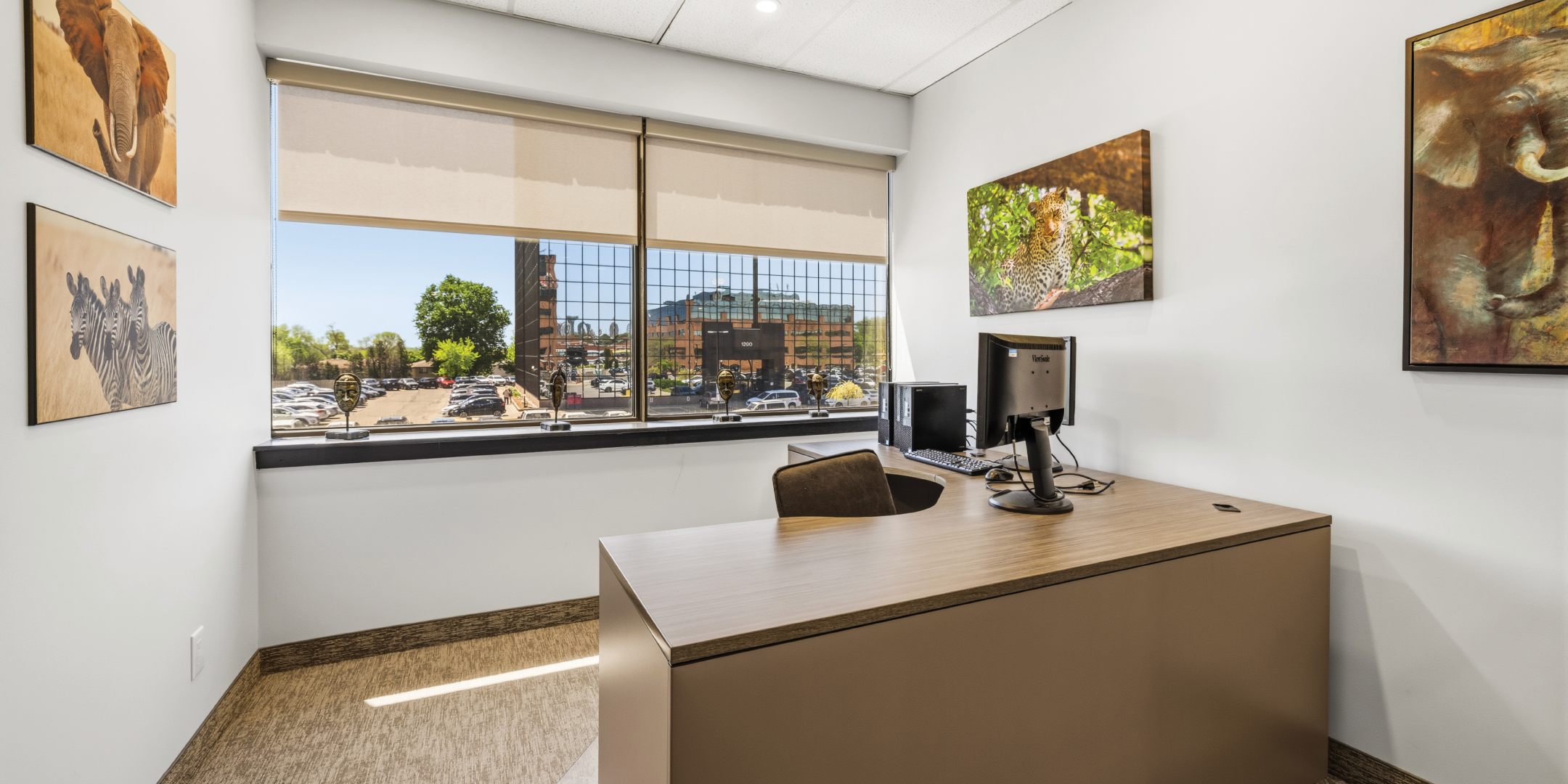 1270 Central Parkway W private office with city views and artwork