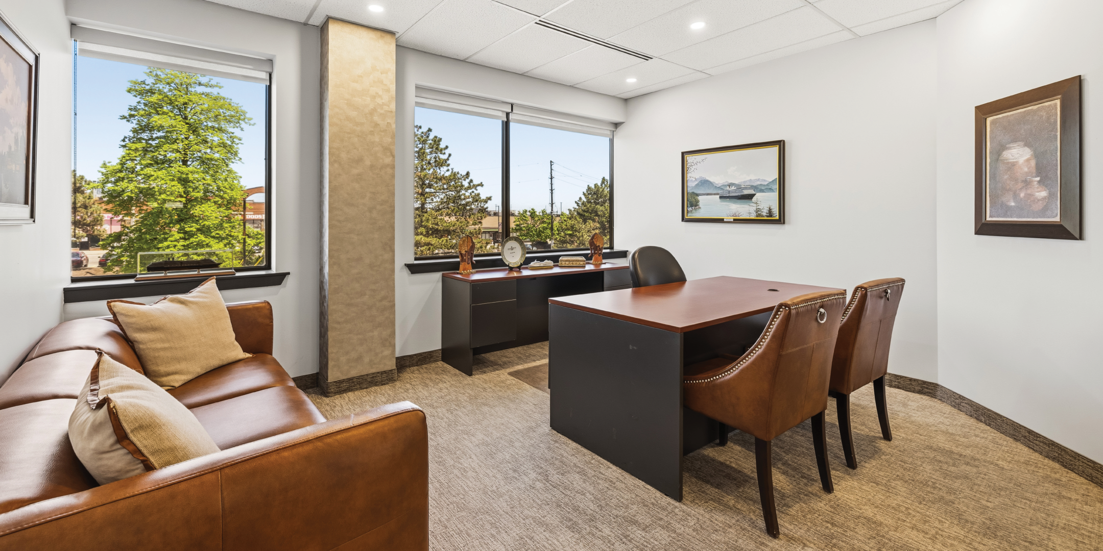 1270 Central Parkway W executive office with leather seating area
