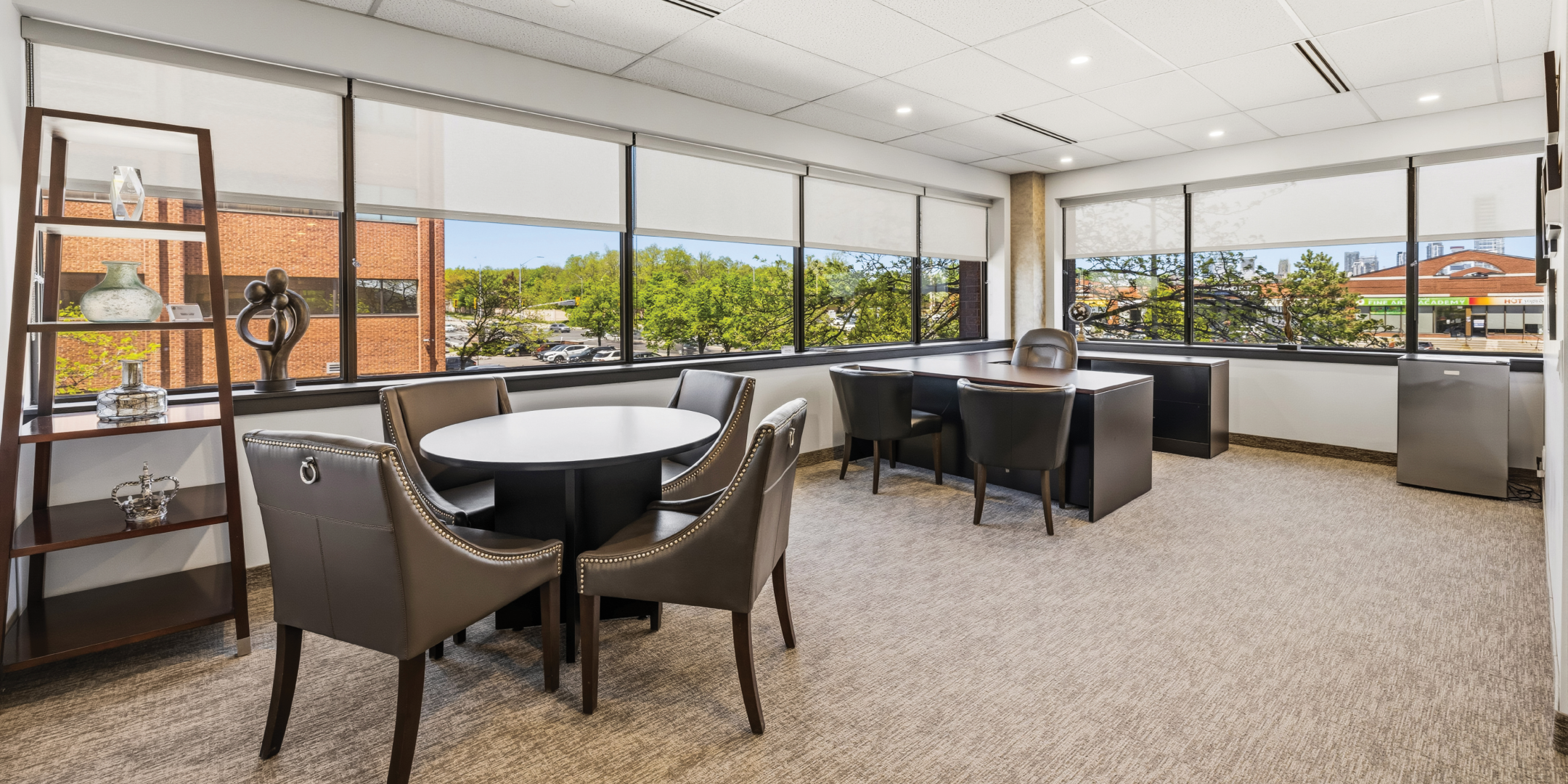 1270 Central Parkway W large executive office with meeting area and windows