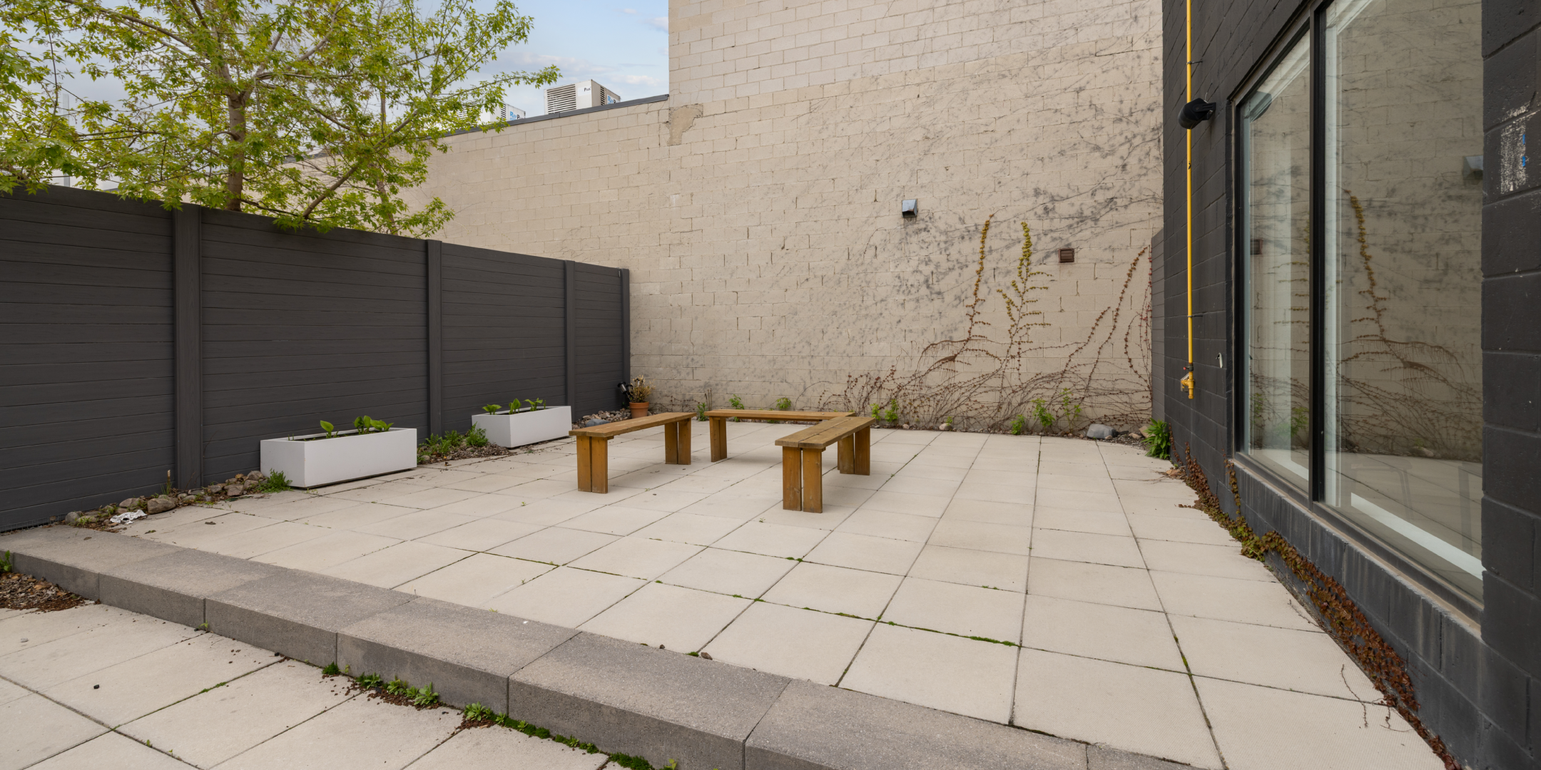 24 McGee outdoor courtyard with benches