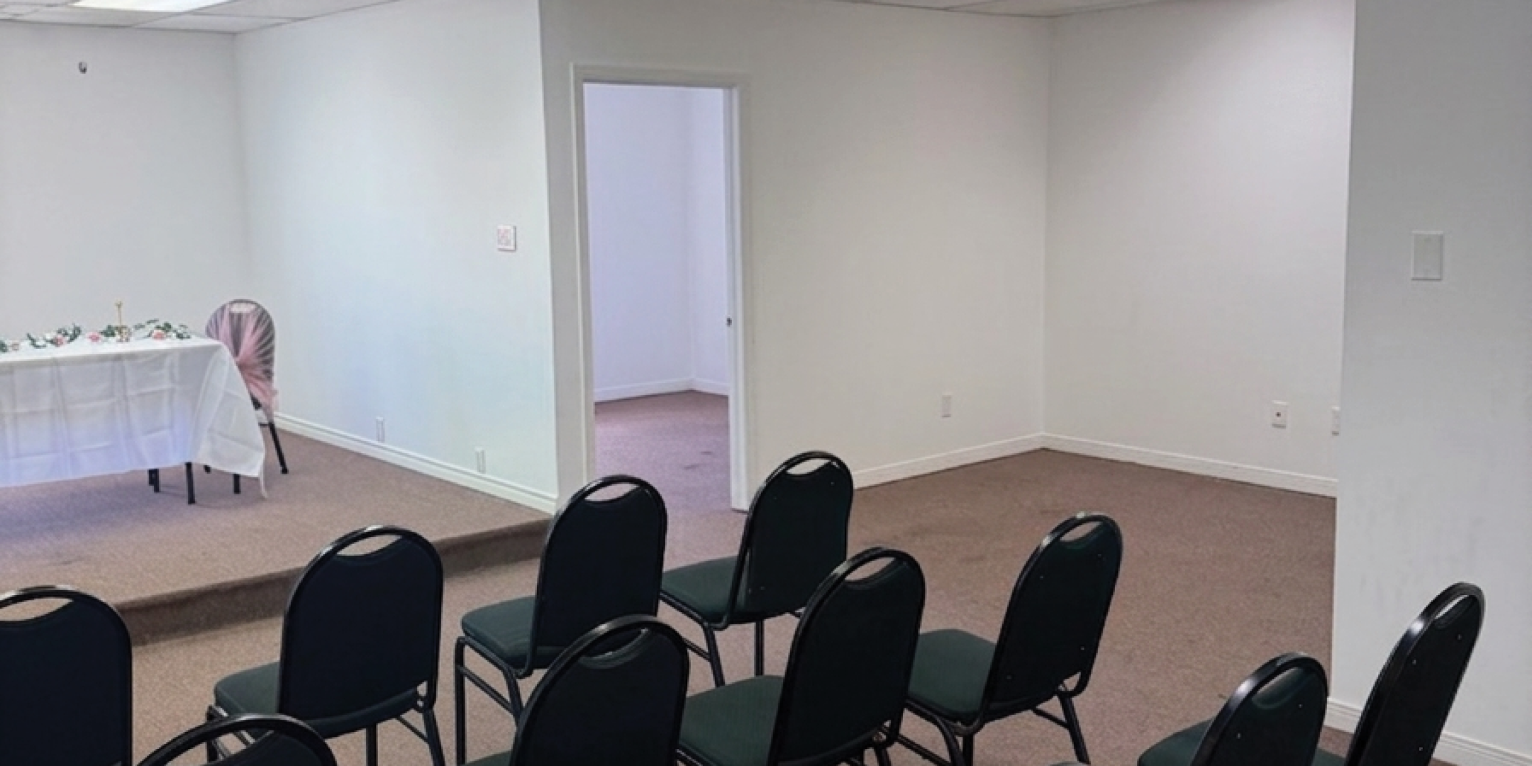 750 Oakdale Road room showing chairs and another empty room