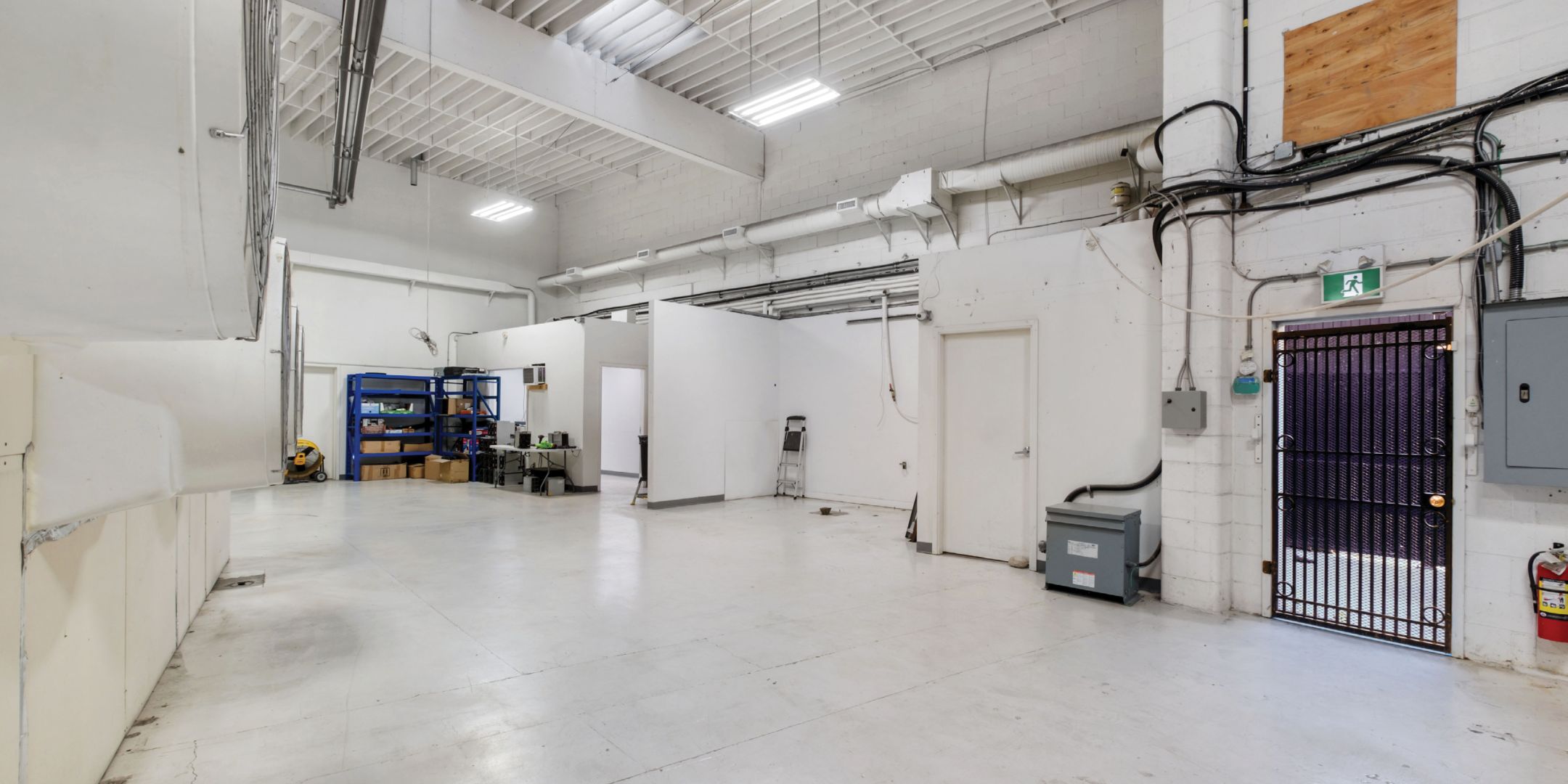 101 Riverside Drive interior showing an open space with while floors and walls