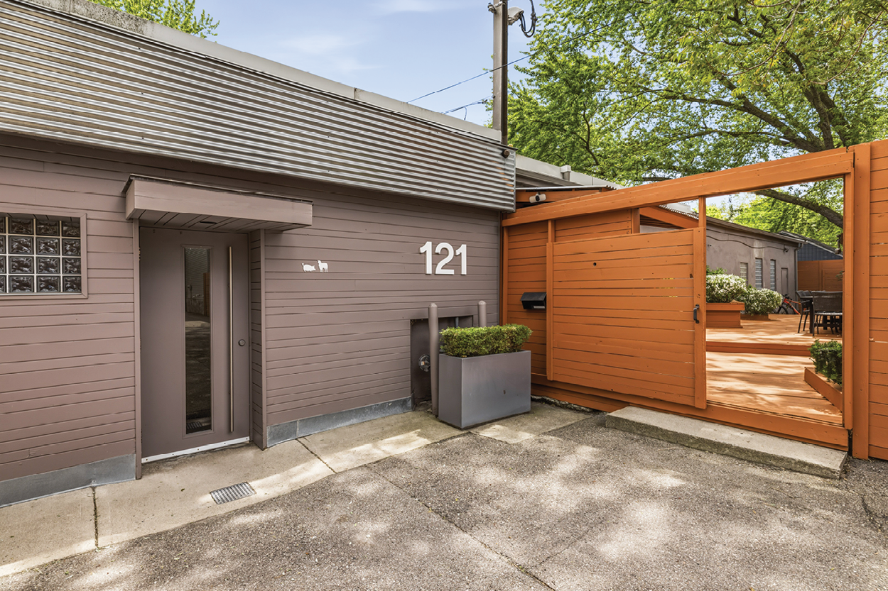121 Logan Ave features a private entrance with a gated courtyard