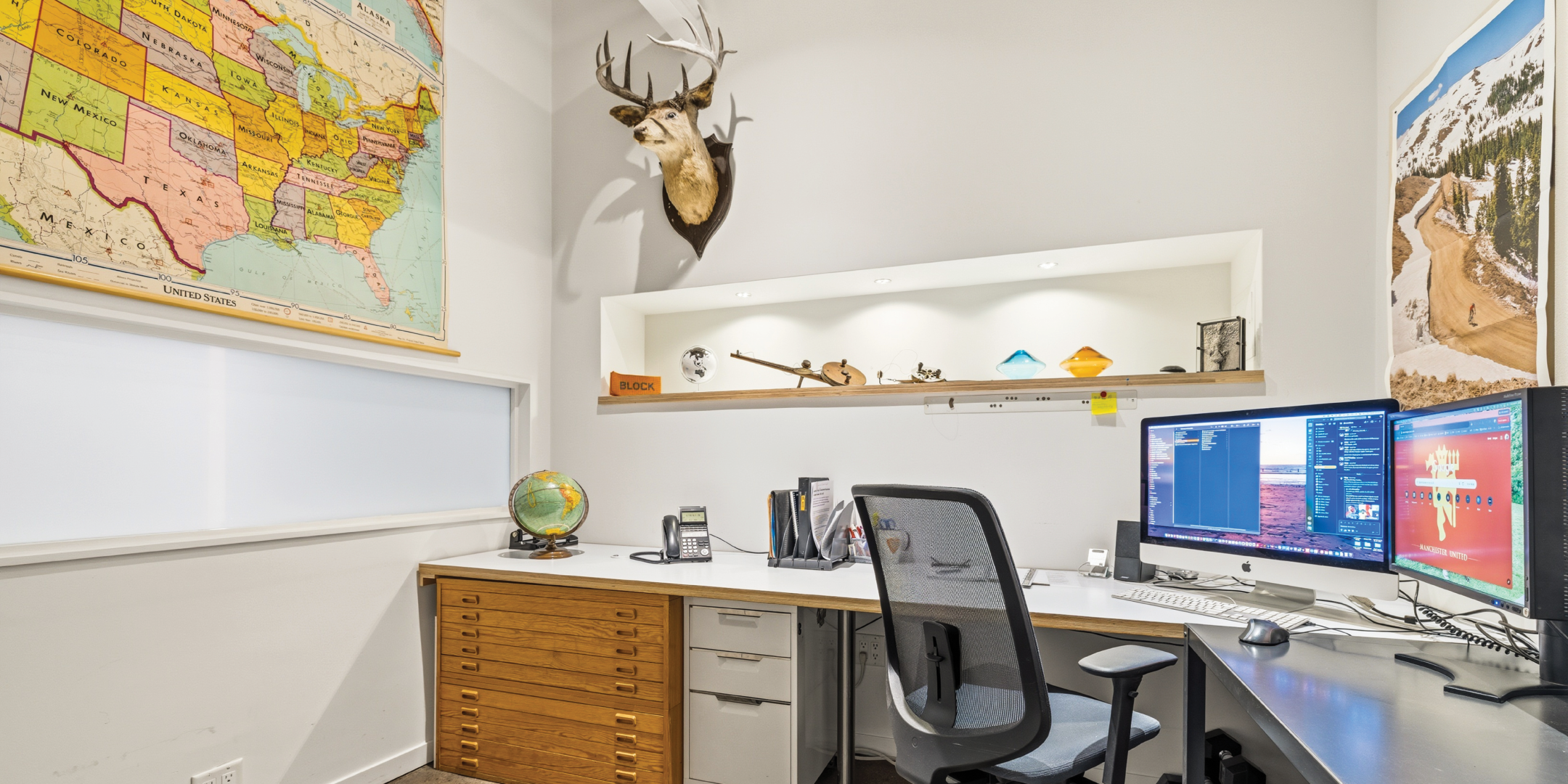 121 Logan Ave includes a private office with custom shelving and dual monitors.
