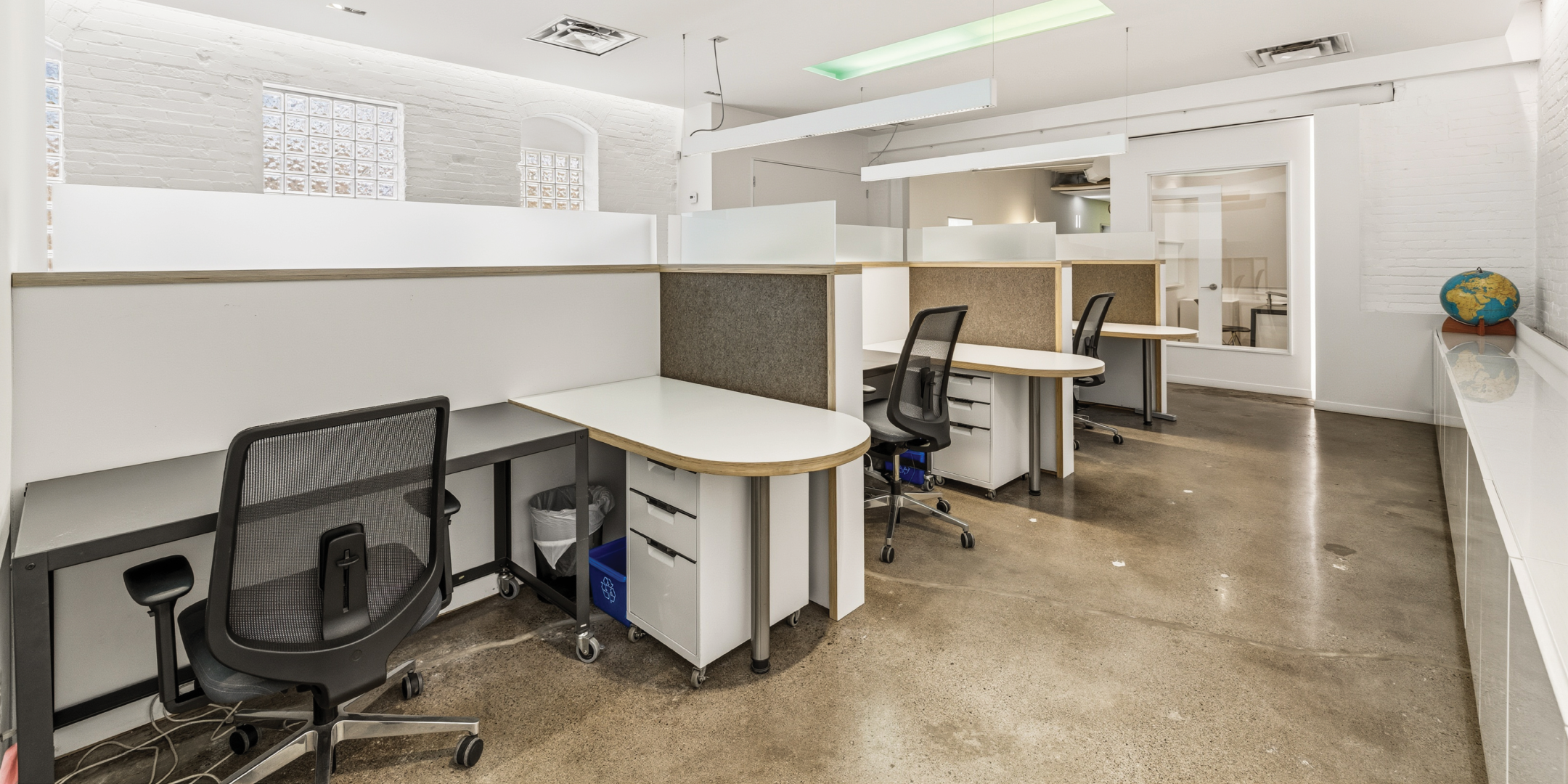 121 Logan Ave features an open office area with modern workstations and natural light