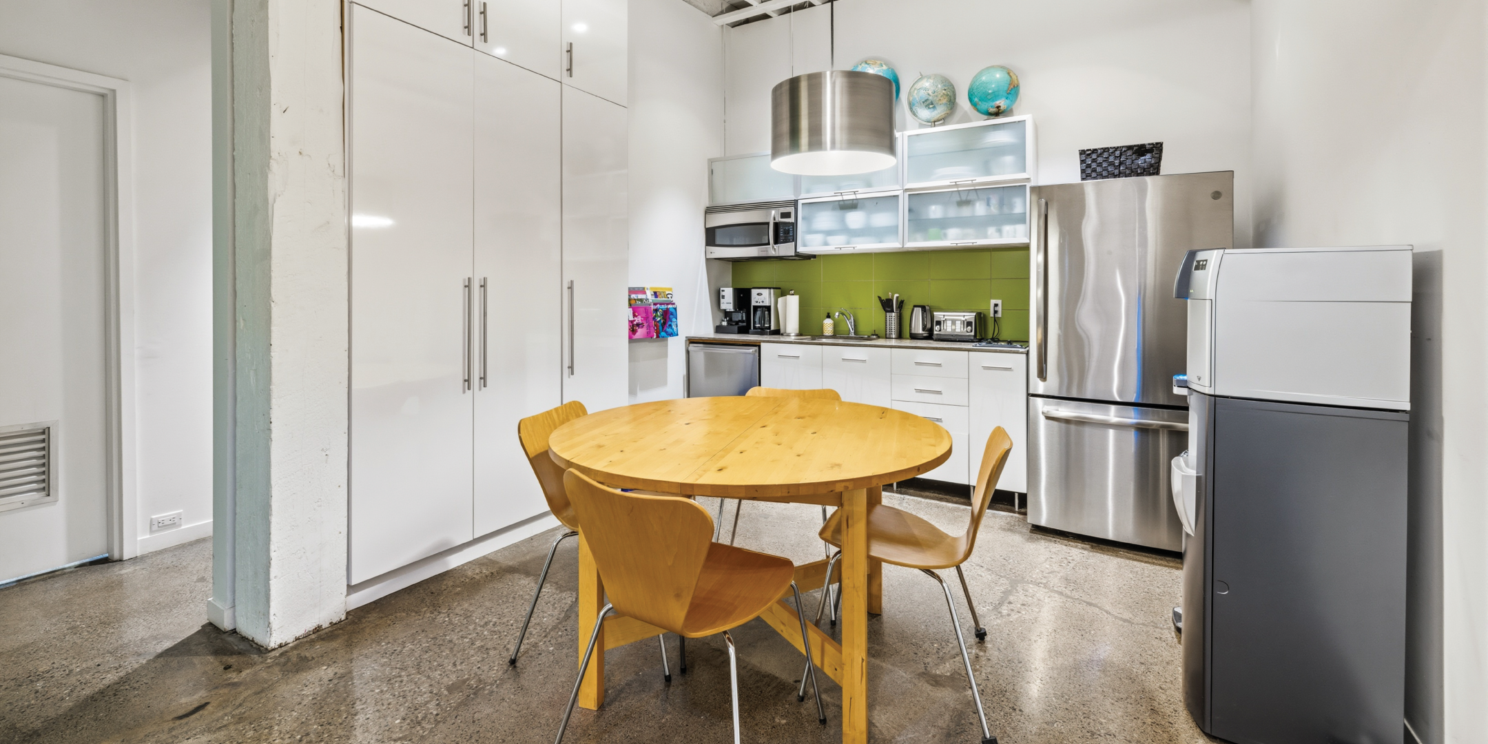 121 Logan Ave includes a bright kitchen with built in storage and stainless steel appliances
