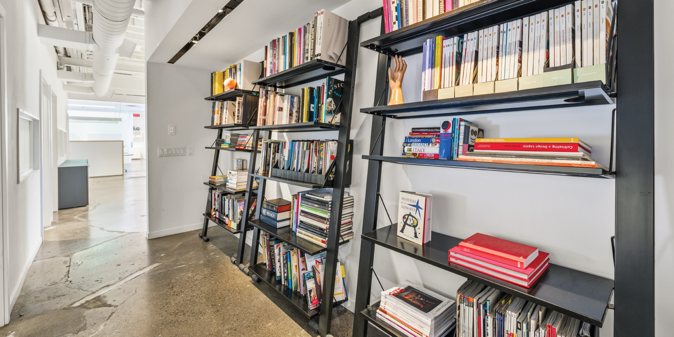 121 Logan Ave includes a library space with floor to ceiling shelving