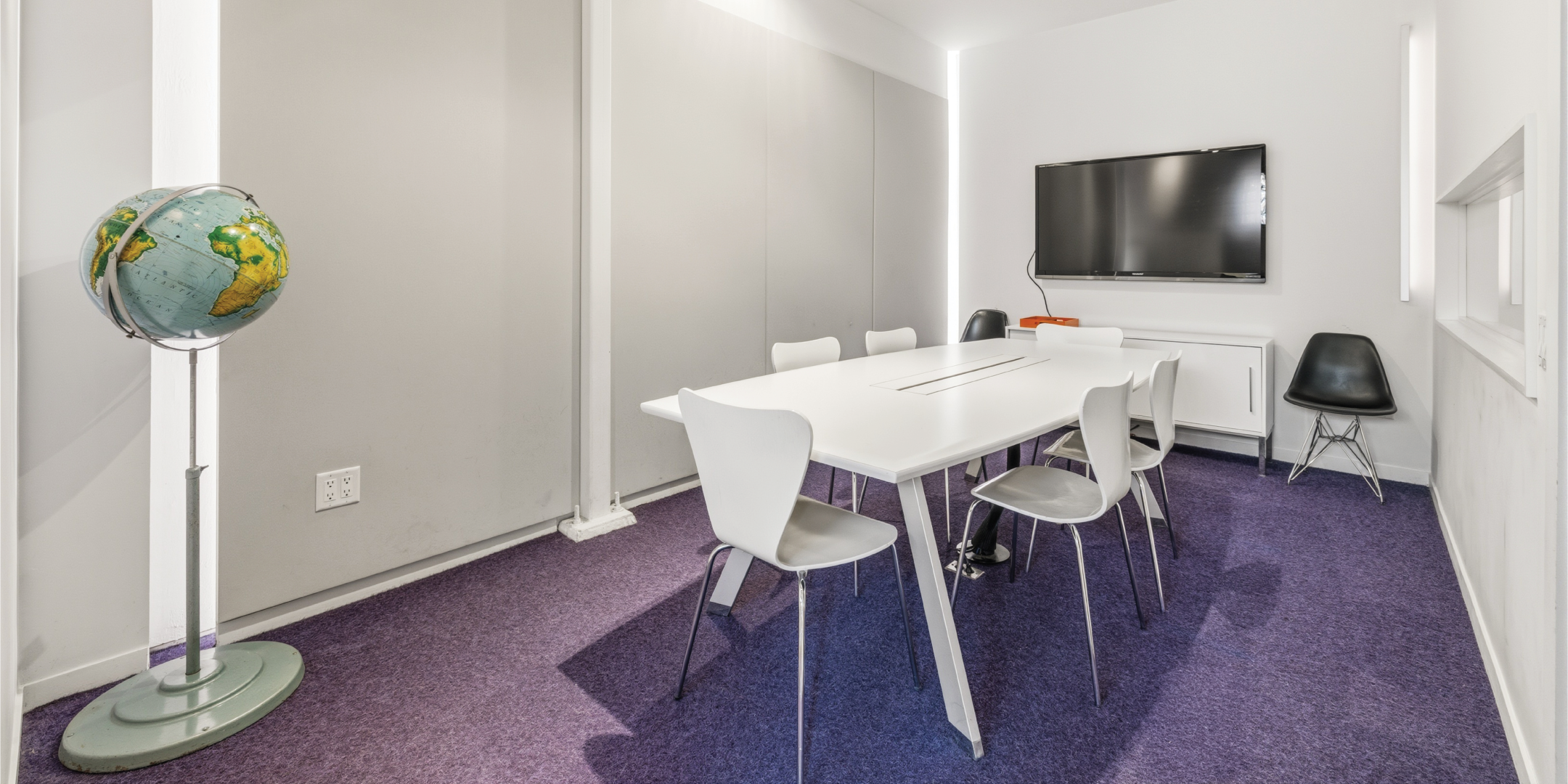 121 Logan Ave features a private meeting room with built in display screens