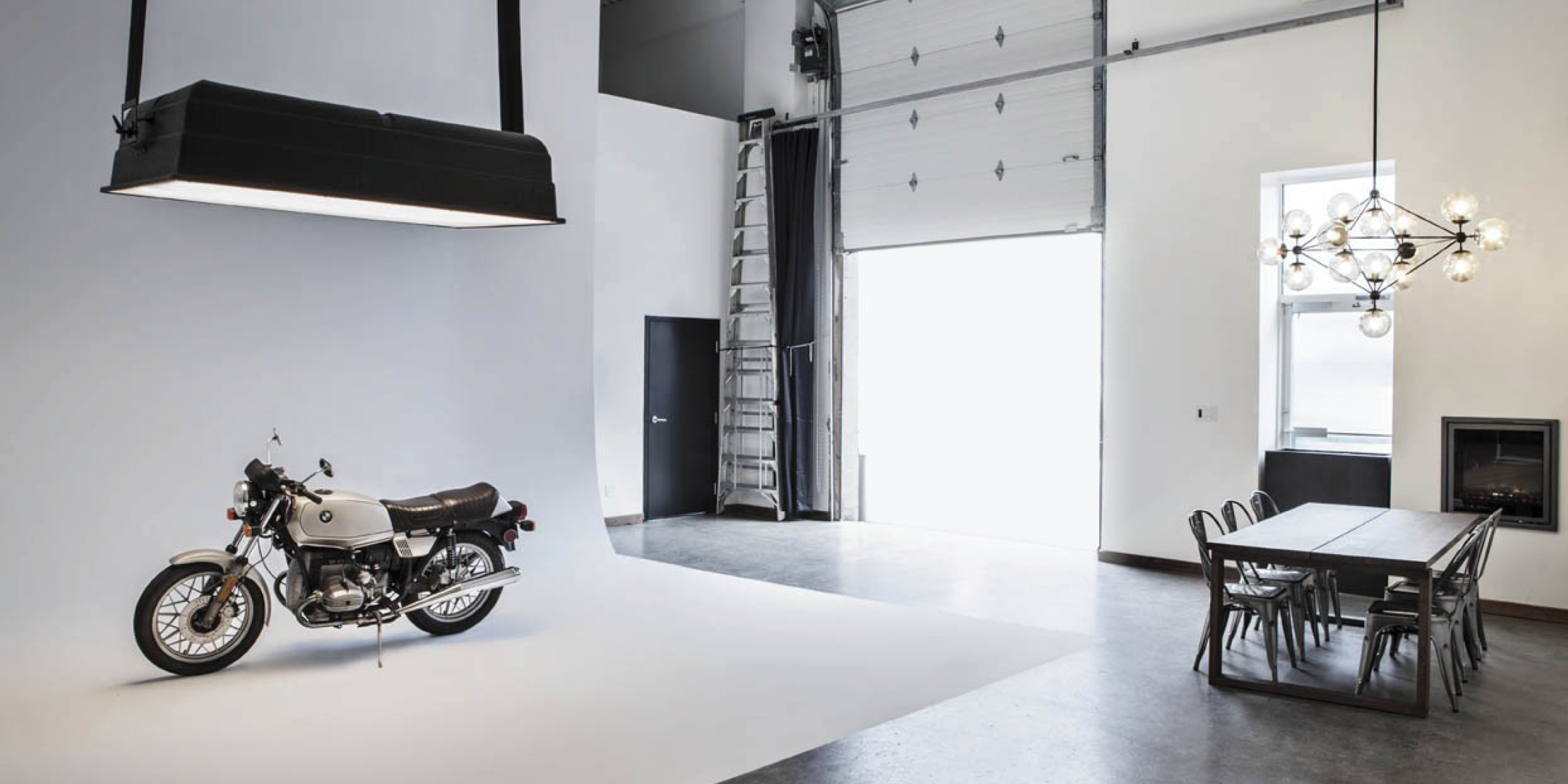 1444 Dupont Street building entrance with a motorcycle and desk 