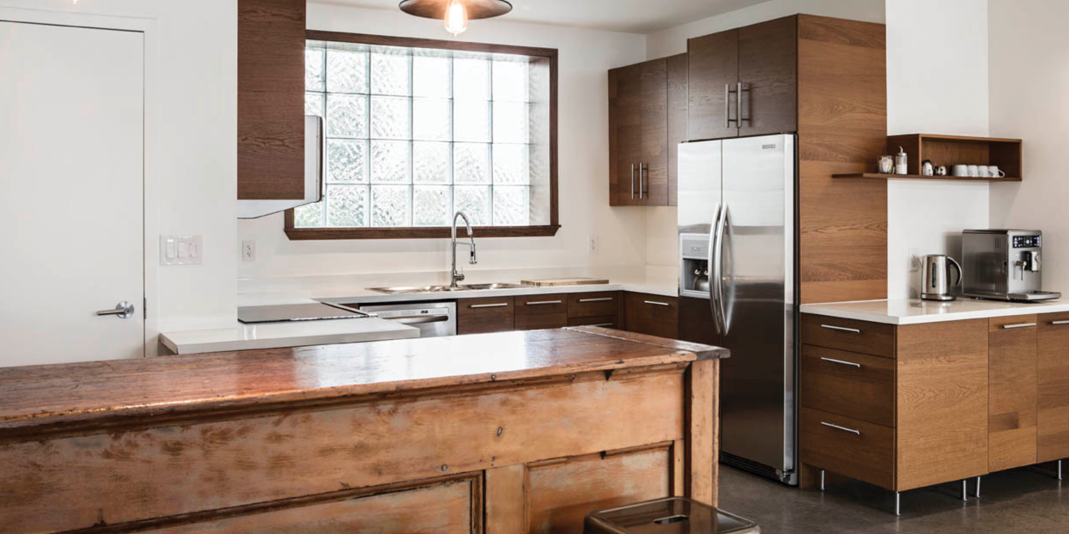 1444 Dupont Street full kitchen with a window overlooking the fridge, cabinet and sink