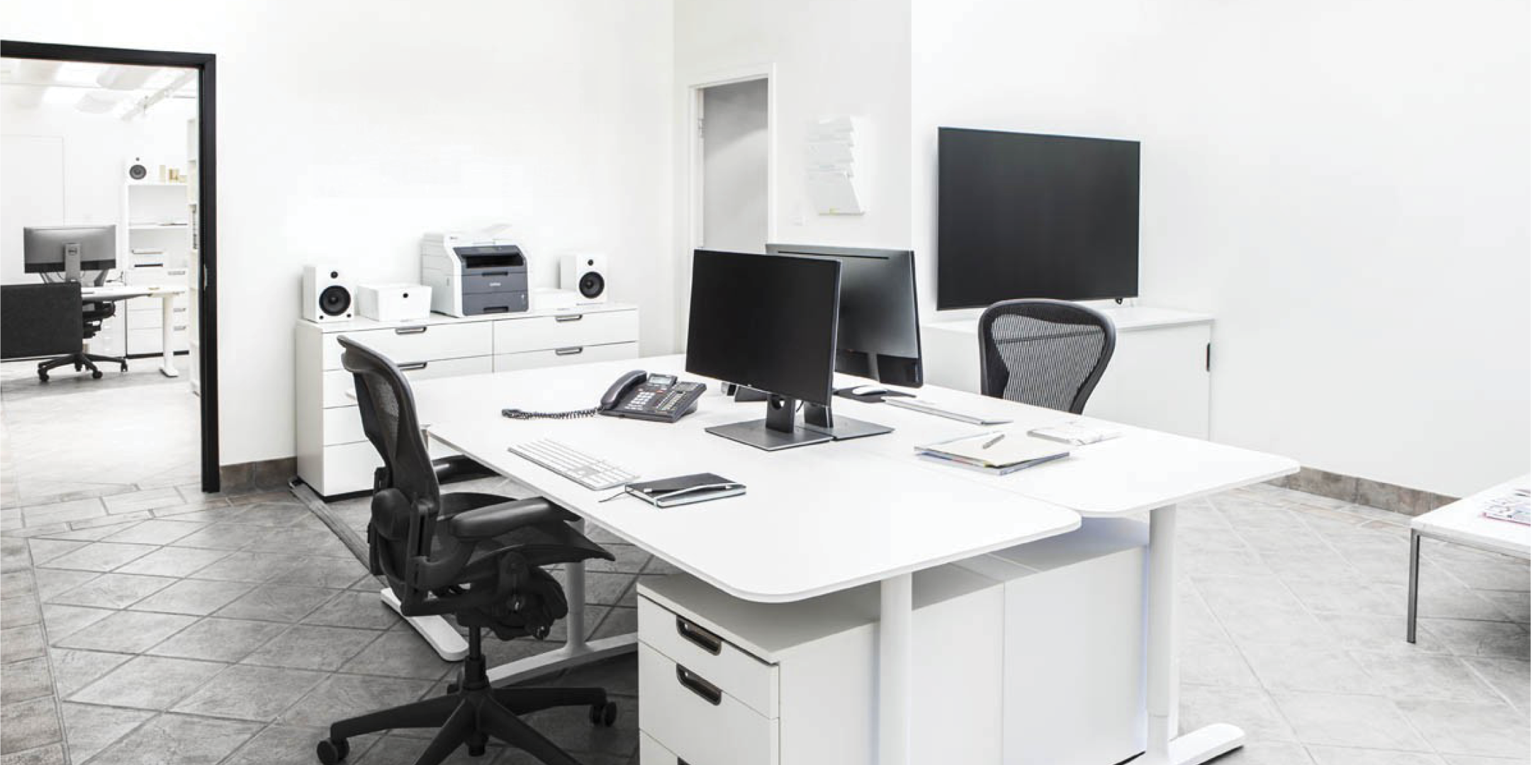 1444 Dupont Street office working station with desk, chairs and monitors