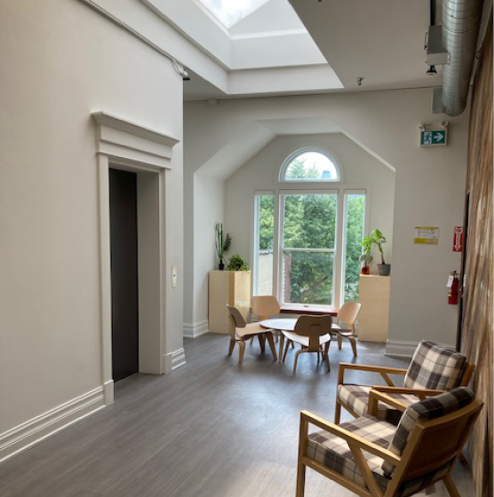 14 Birch Avenue lounge area with a big window overlooking the chairs