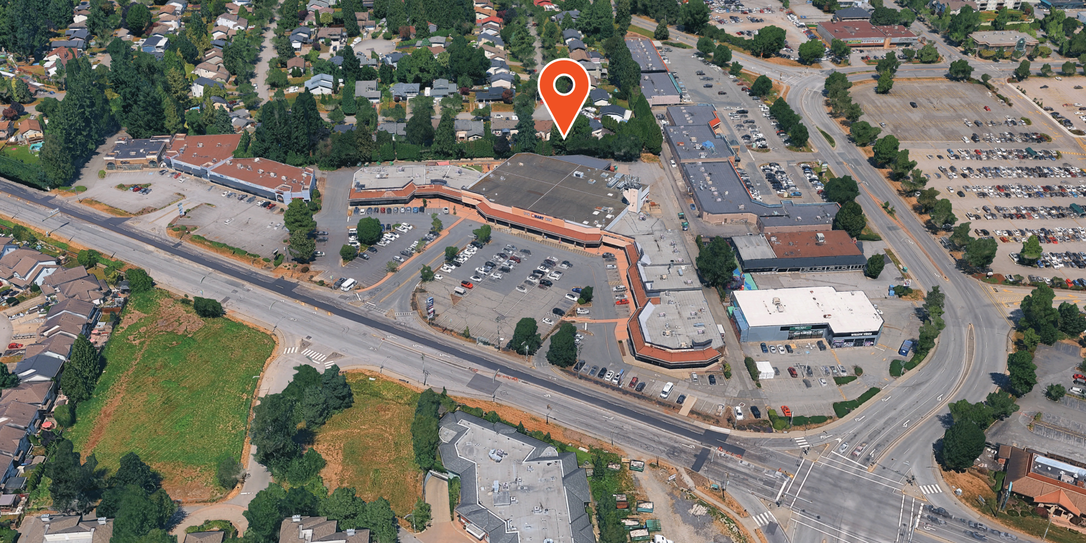 Aerial view of the Westbrook Centre with a location pin on the 19555 Fraser Highway building