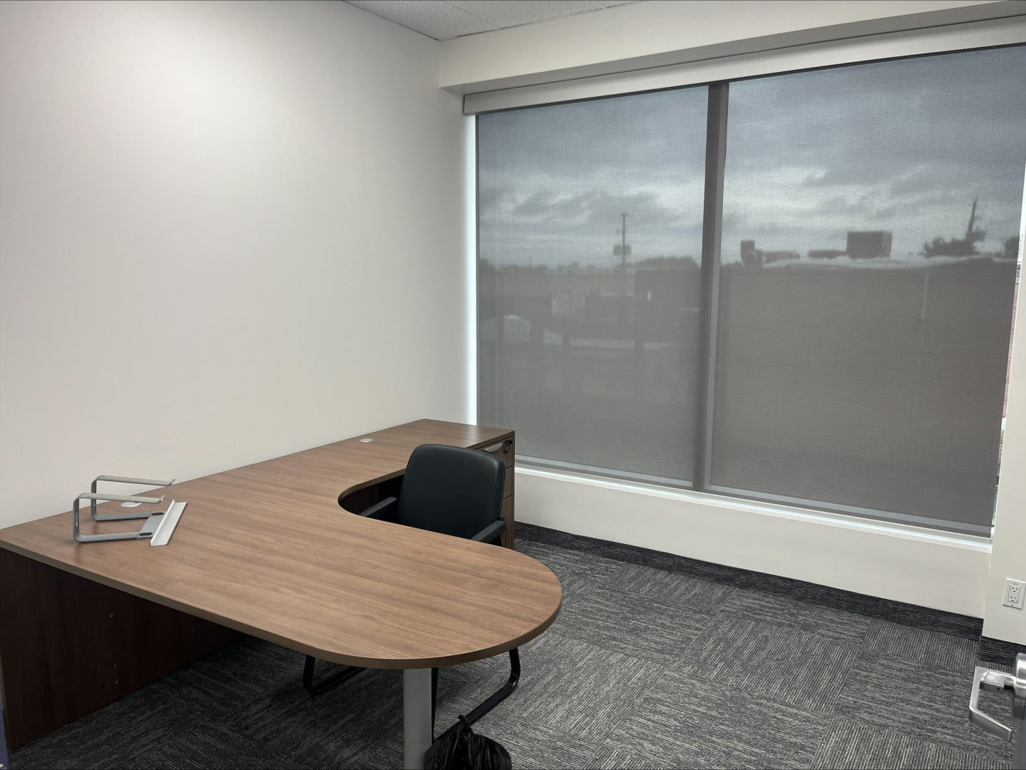 4190 South Service Road private office with L-shpaed desk and chair