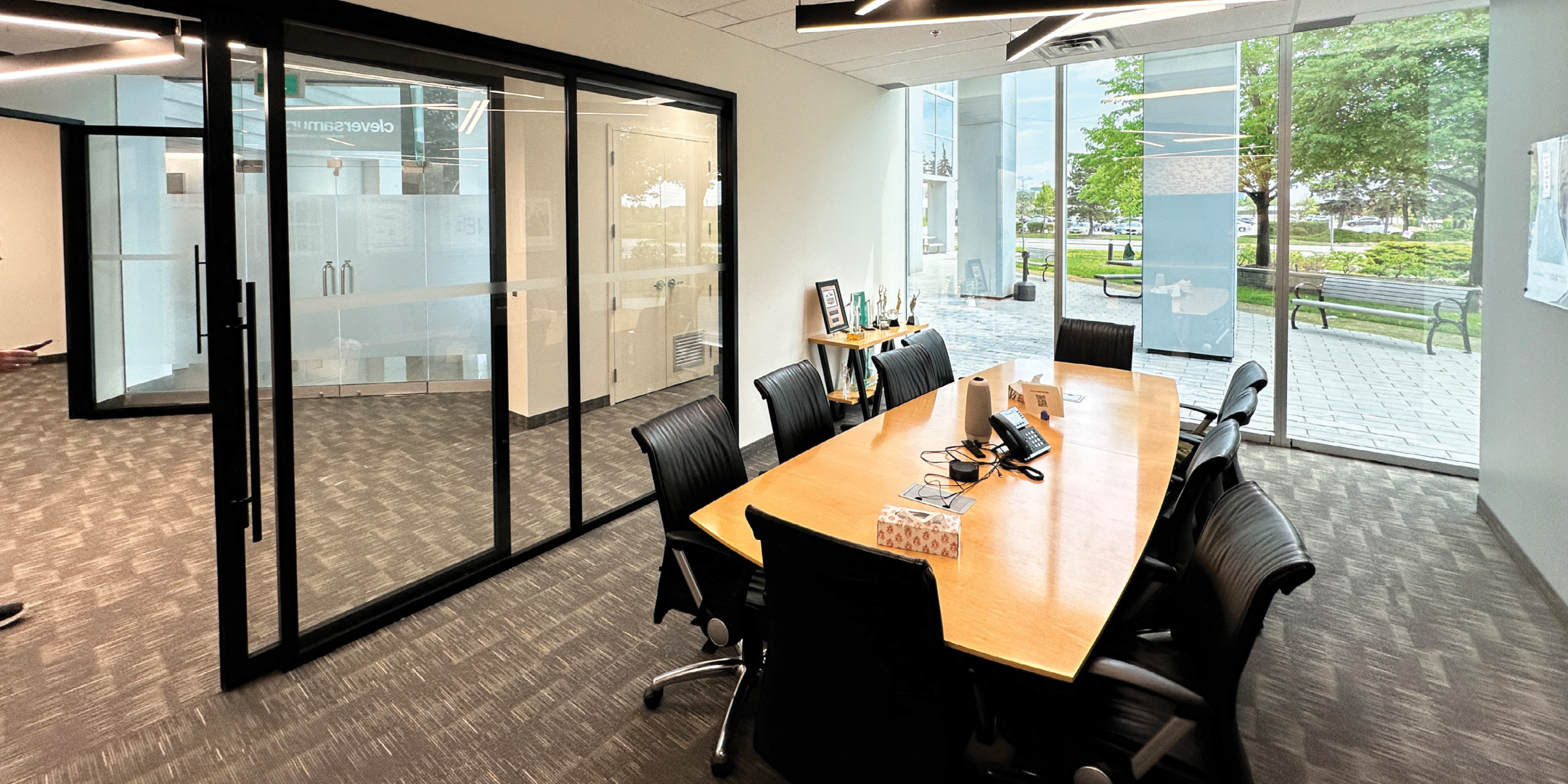 5090 Explorer Dr large boardroom with conference table and exterior views.