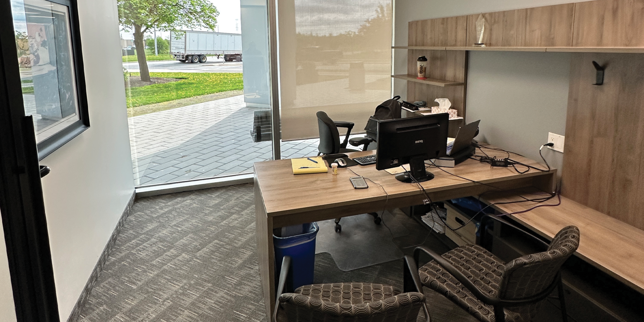 5090 Explorer Dr glass front private offices with modern finishes.