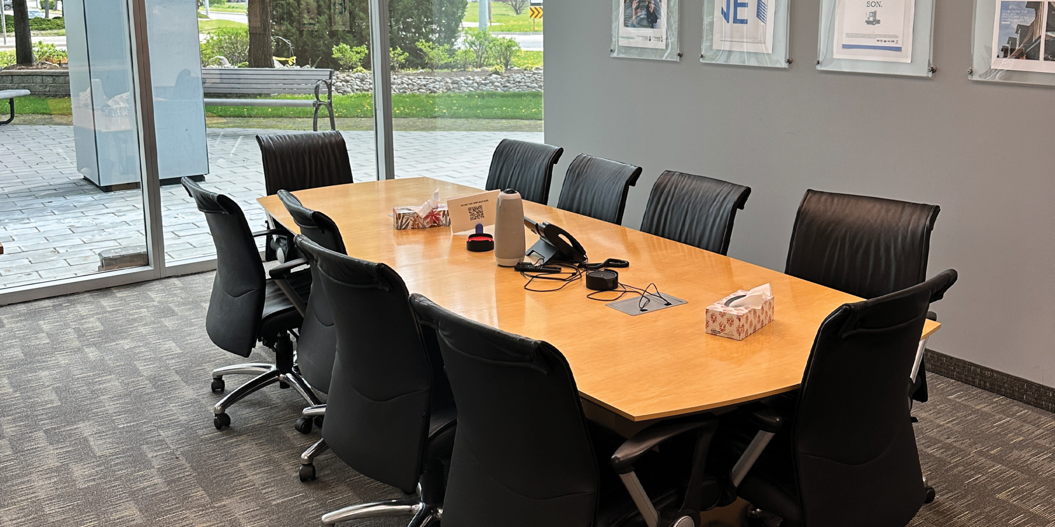 5090 Explorer Dr boardroom with conference seating and floor to ceiling windows.